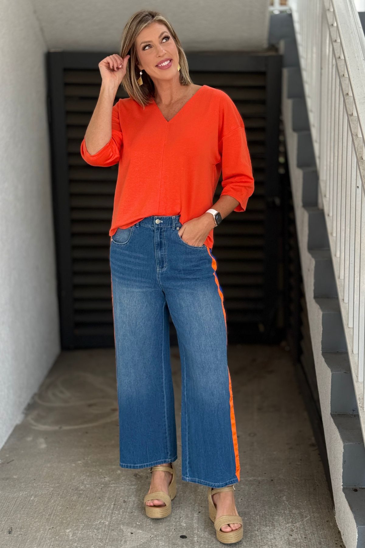 Women's washed denim pants with orange and royal blue stripe