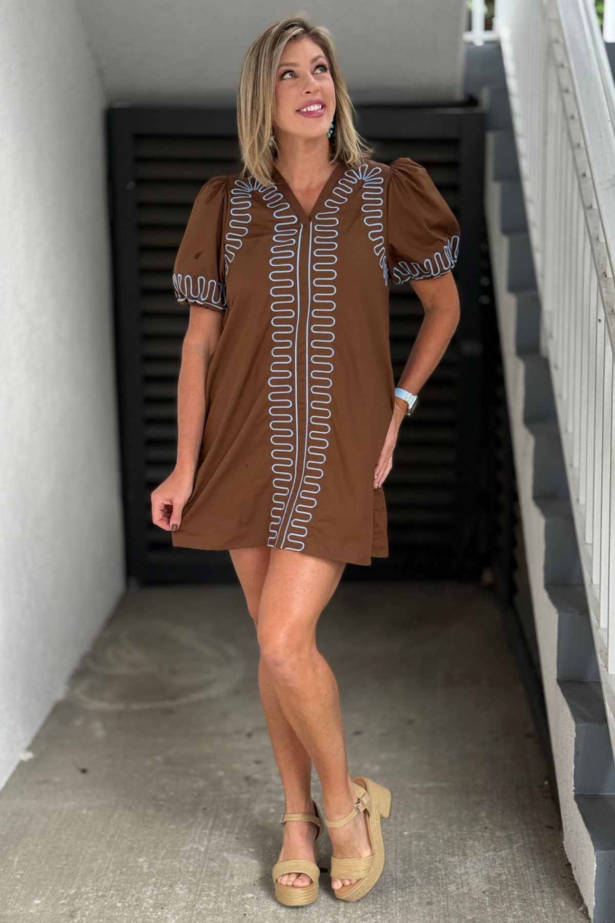 Brown V-neck dress with light blue embroidery