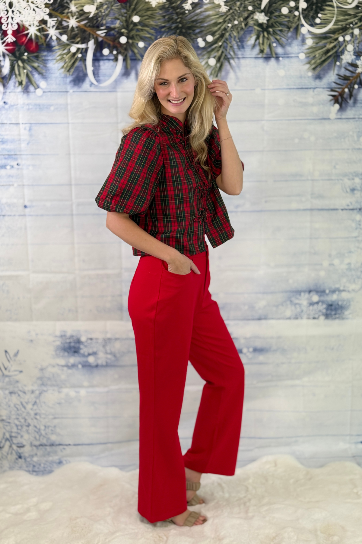 Women’s red bootcut holiday pants styled for Christmas