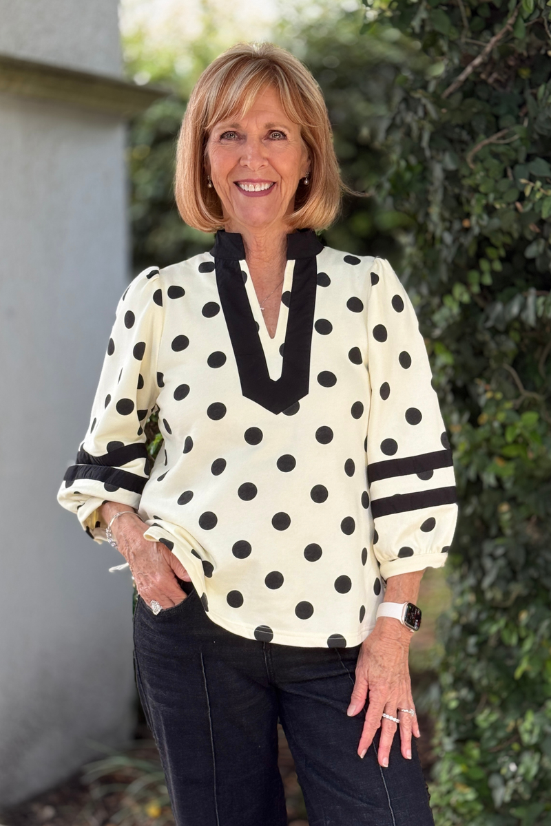 Women's cream and black polka dot blouse with puff sleeves