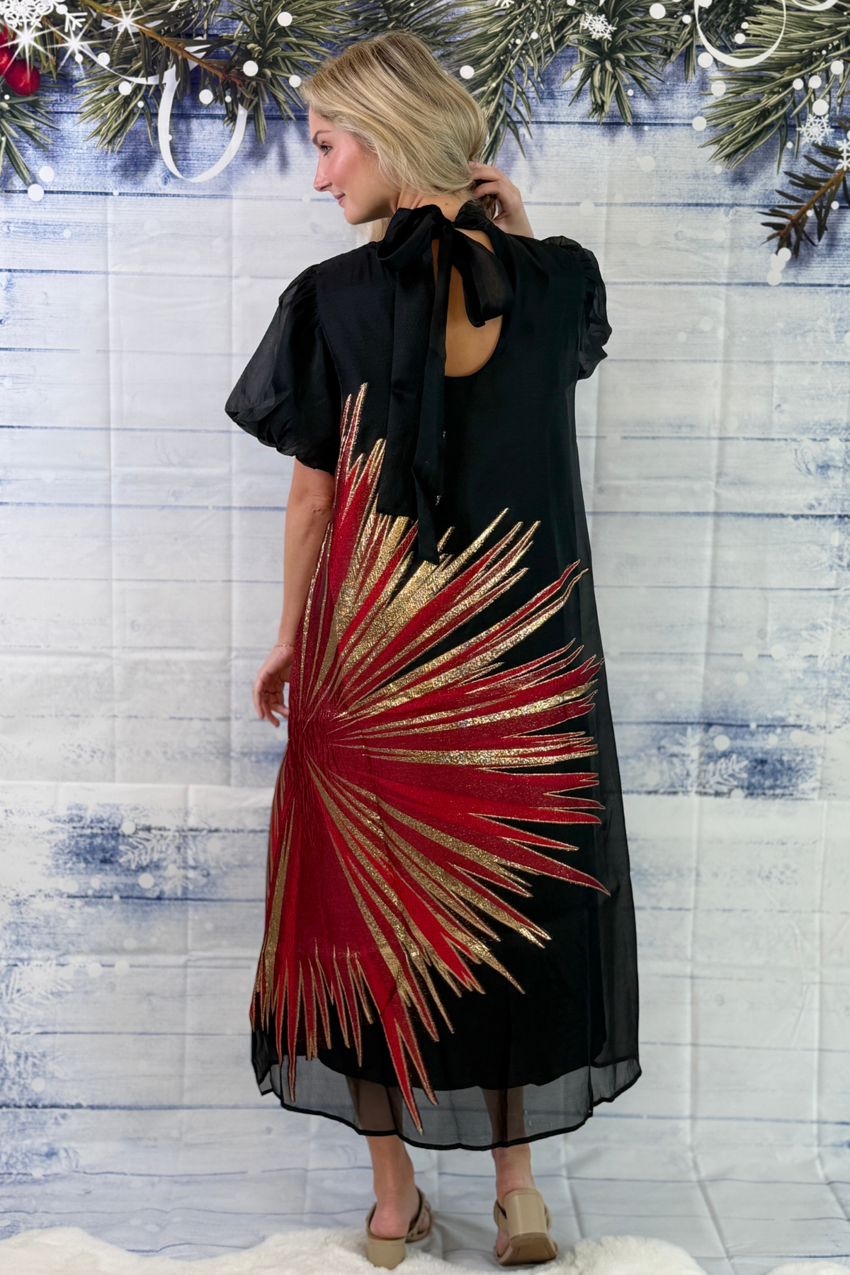 Black A-line midi dress with dramatic metallic starburst print