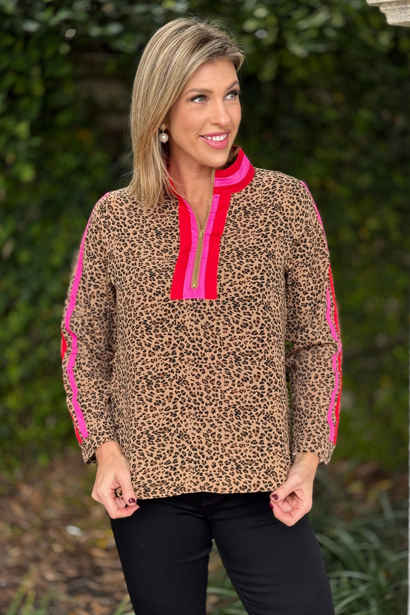 Women's leopard quarter zip top with hot pink and red trim