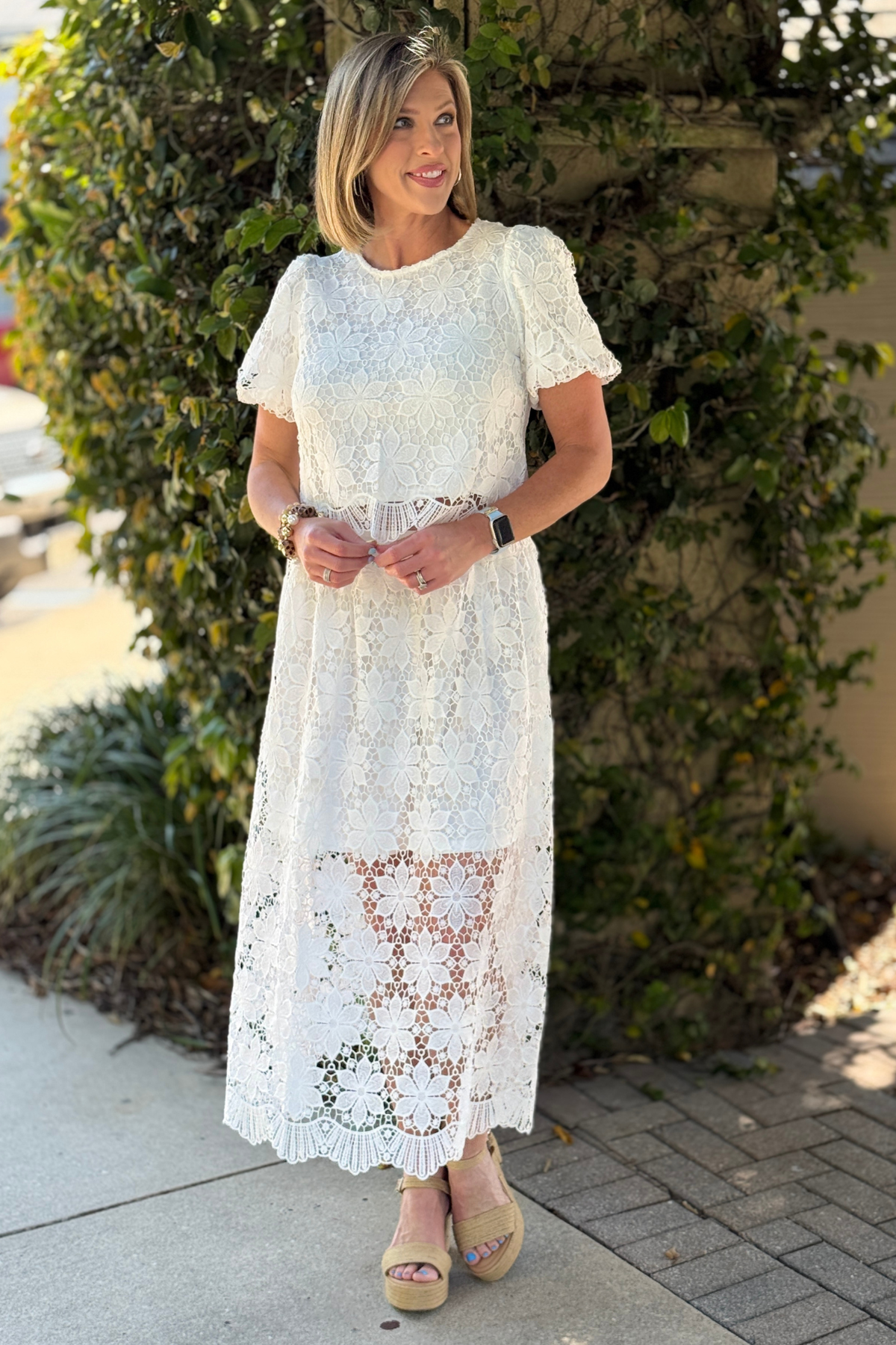 women’s white lace skirt styled for spring outfit