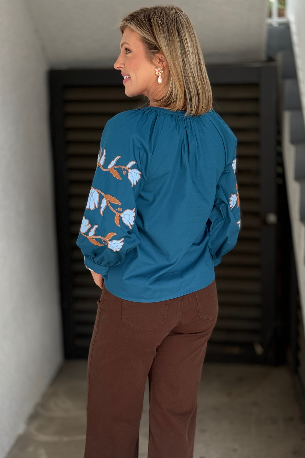 Women’s embroidered fall top in teal blue and brown