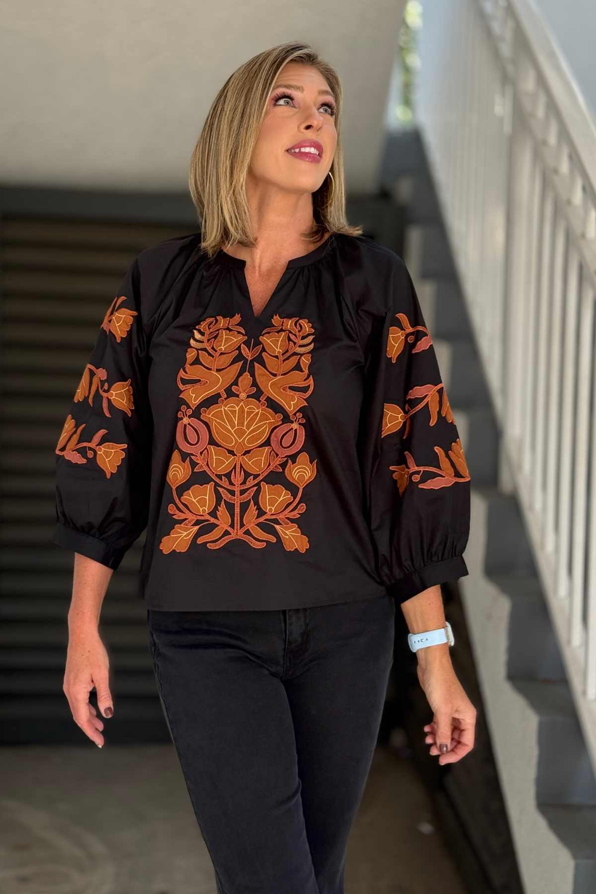 Black embroidered cotton top with rust floral embroidery