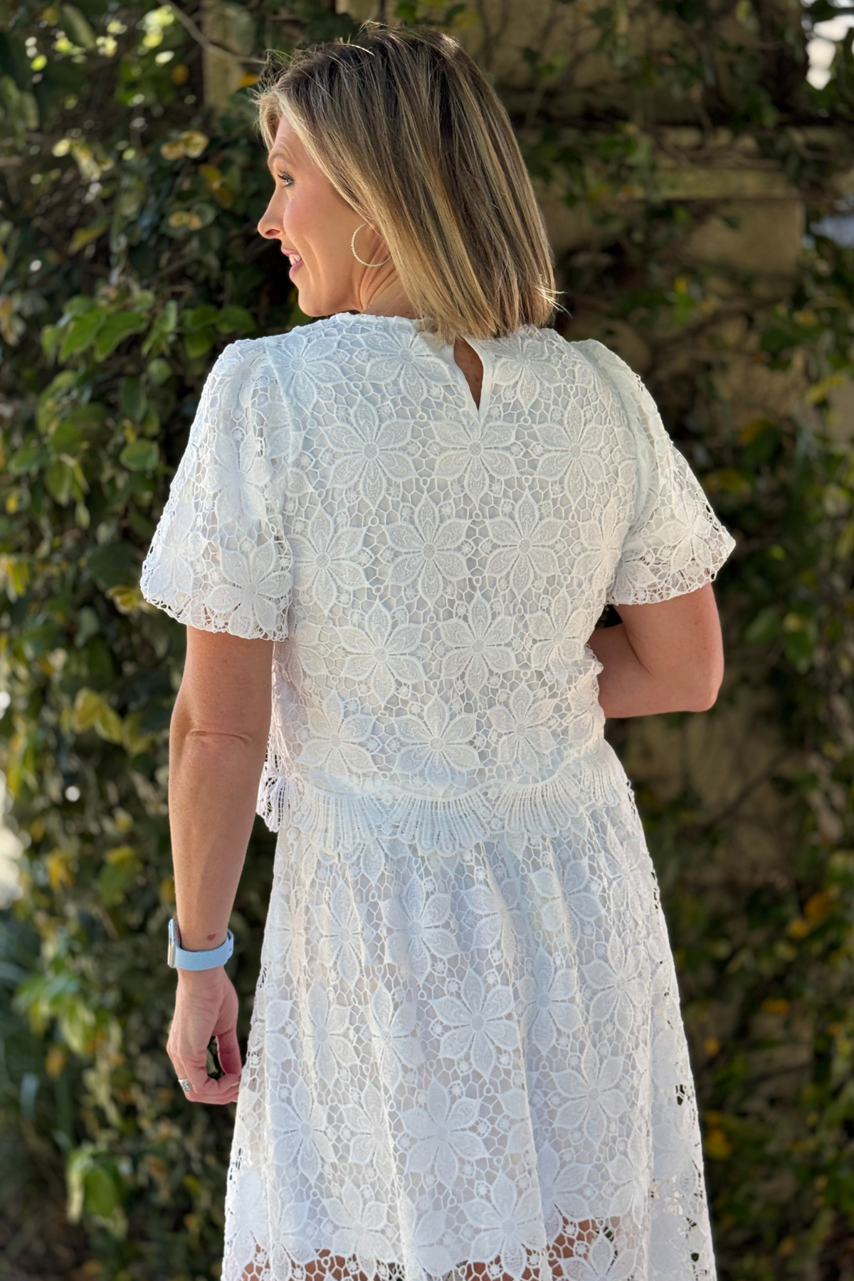 dressy white lace top styled for spring outfit