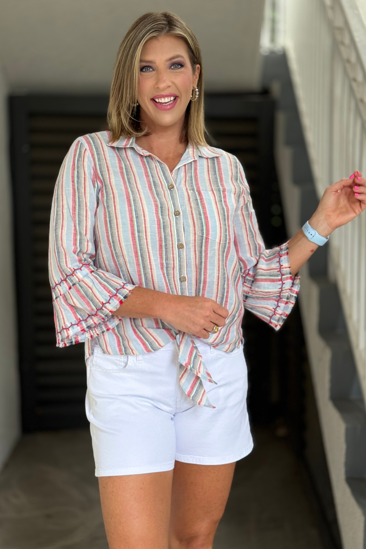 ruffle sleeve striped top styled with white pants