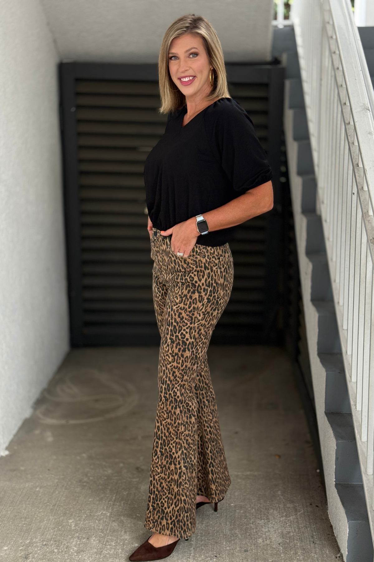 Boutique leopard print flare jeans with dramatic wide-leg silhouette.
