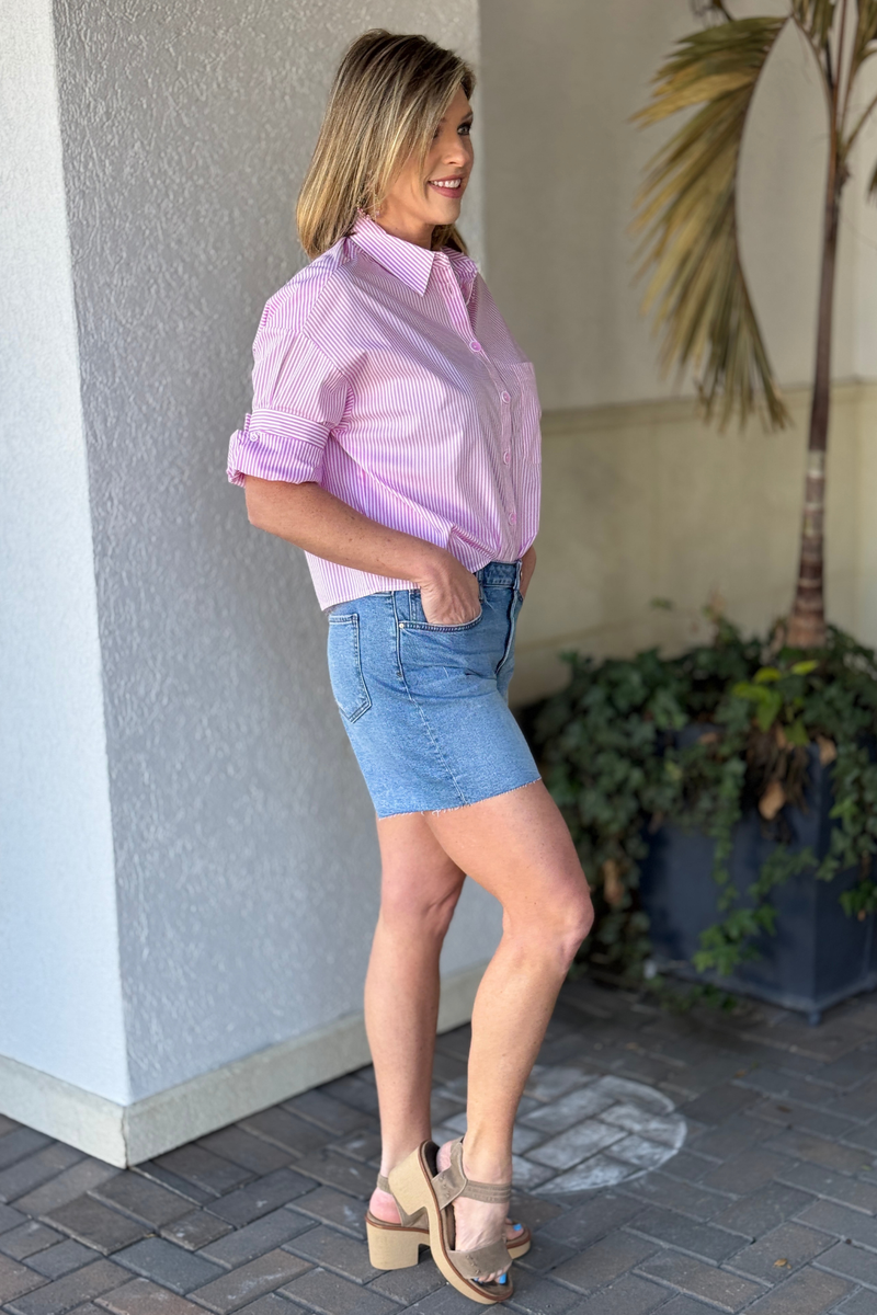 KUT high rise medium wash denim shorts front view