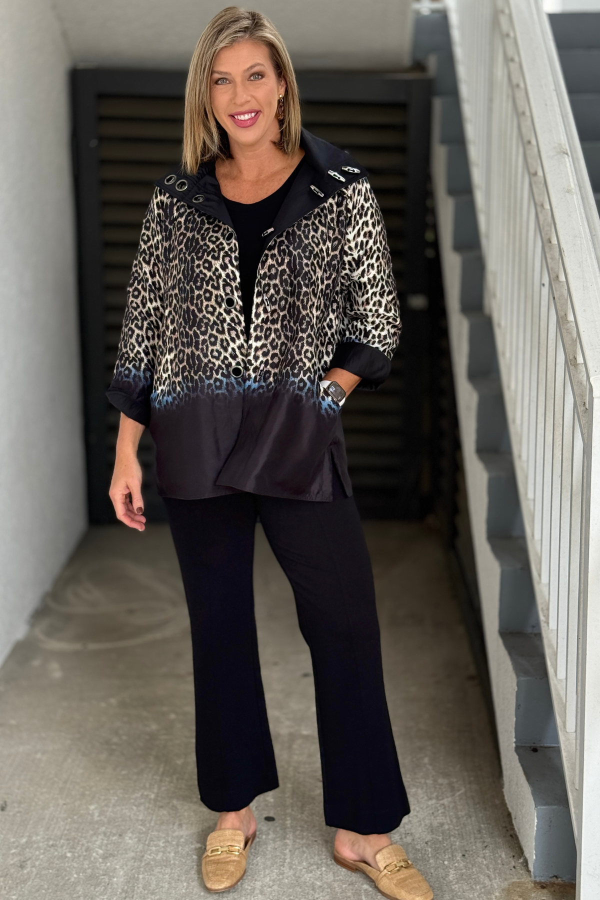 Reversible leopard and black women’s statement jacket styled with black pants