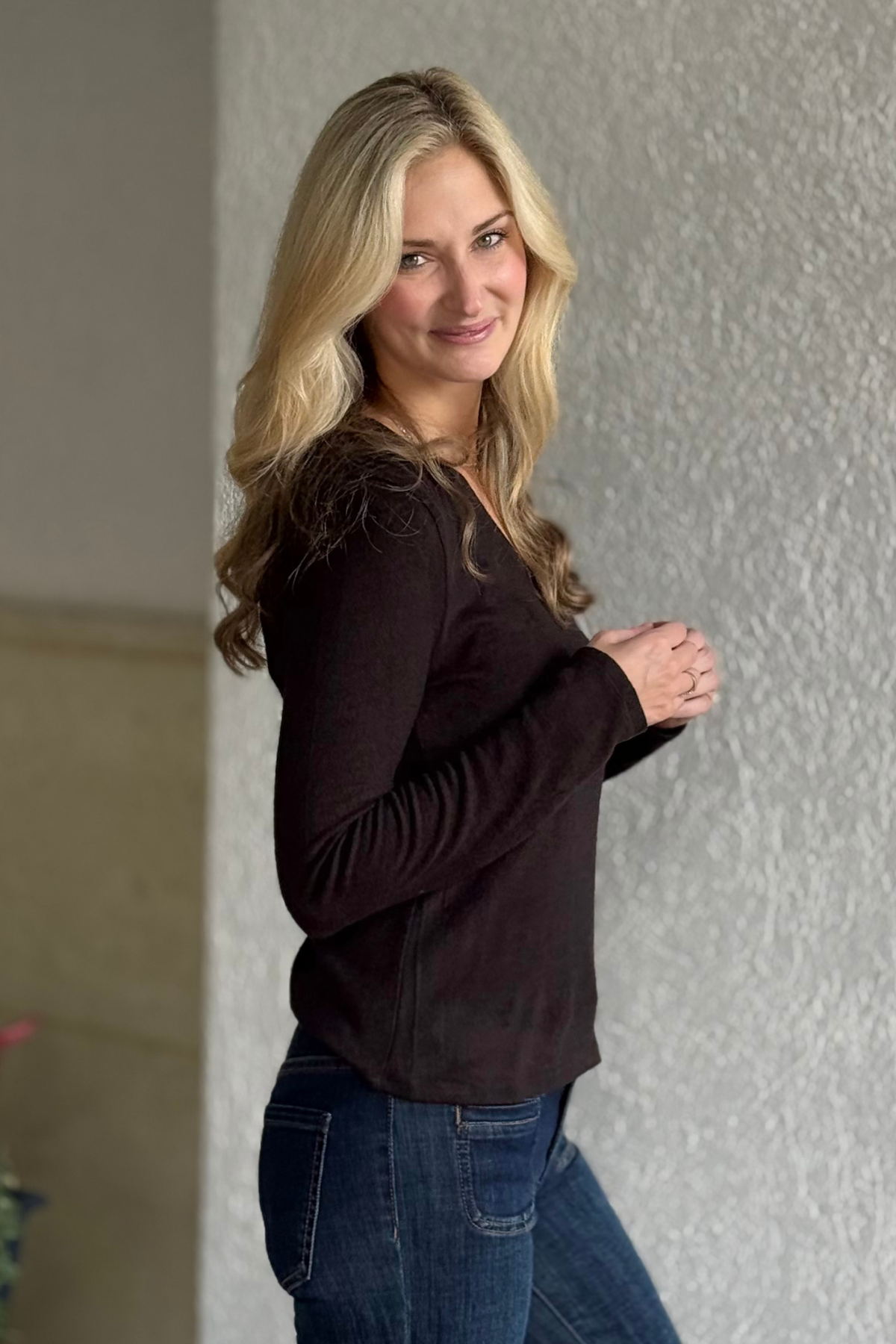 Model wearing Liverpool Java Mélange V-Neck Knit Top showing front view.