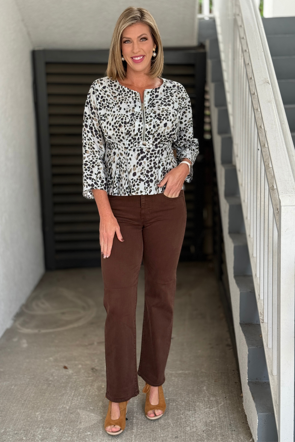 Women’s Liverpool brown straight leg jeans styled with animal print top