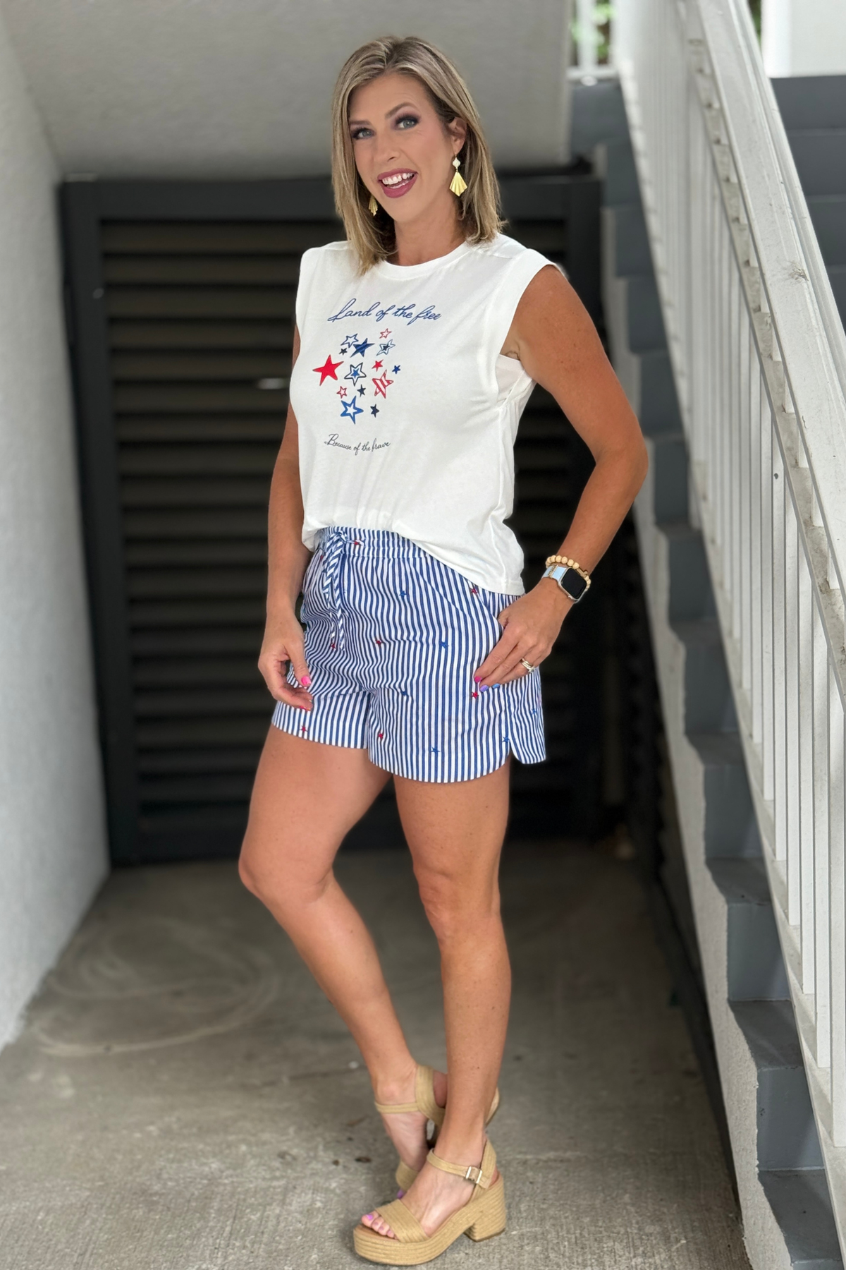 Blue and white striped shorts with embroidered stars and drawstring waist