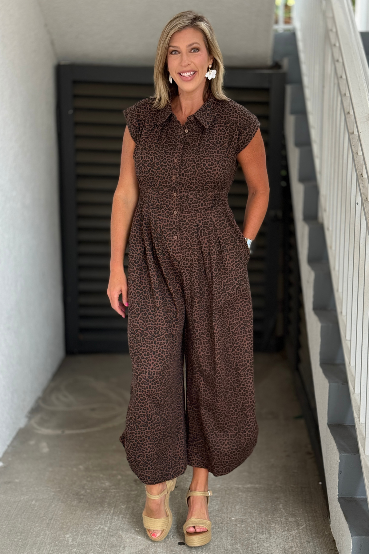 Front view of The Wild Instinct Drawstring Jumpsuit in leopard print.