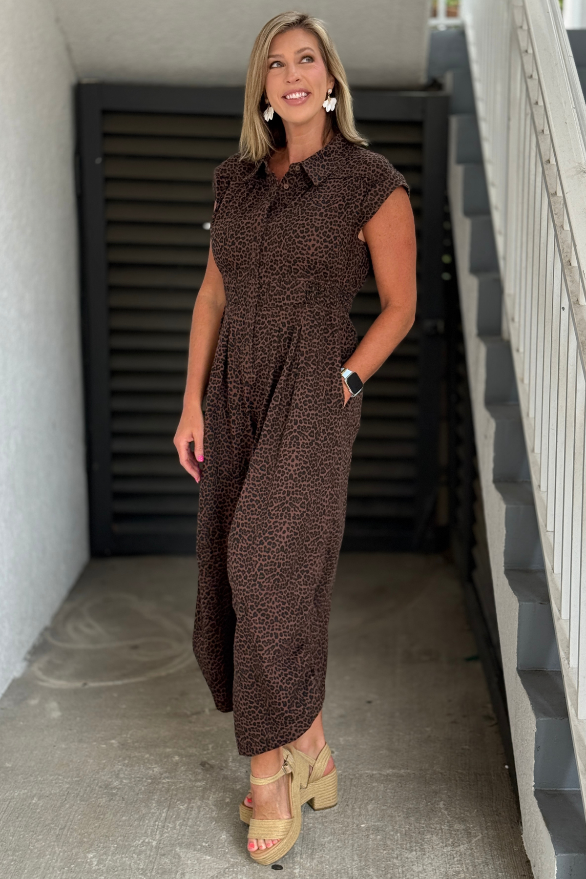 Angled front view showing the wide leg silhouette and button-front design.