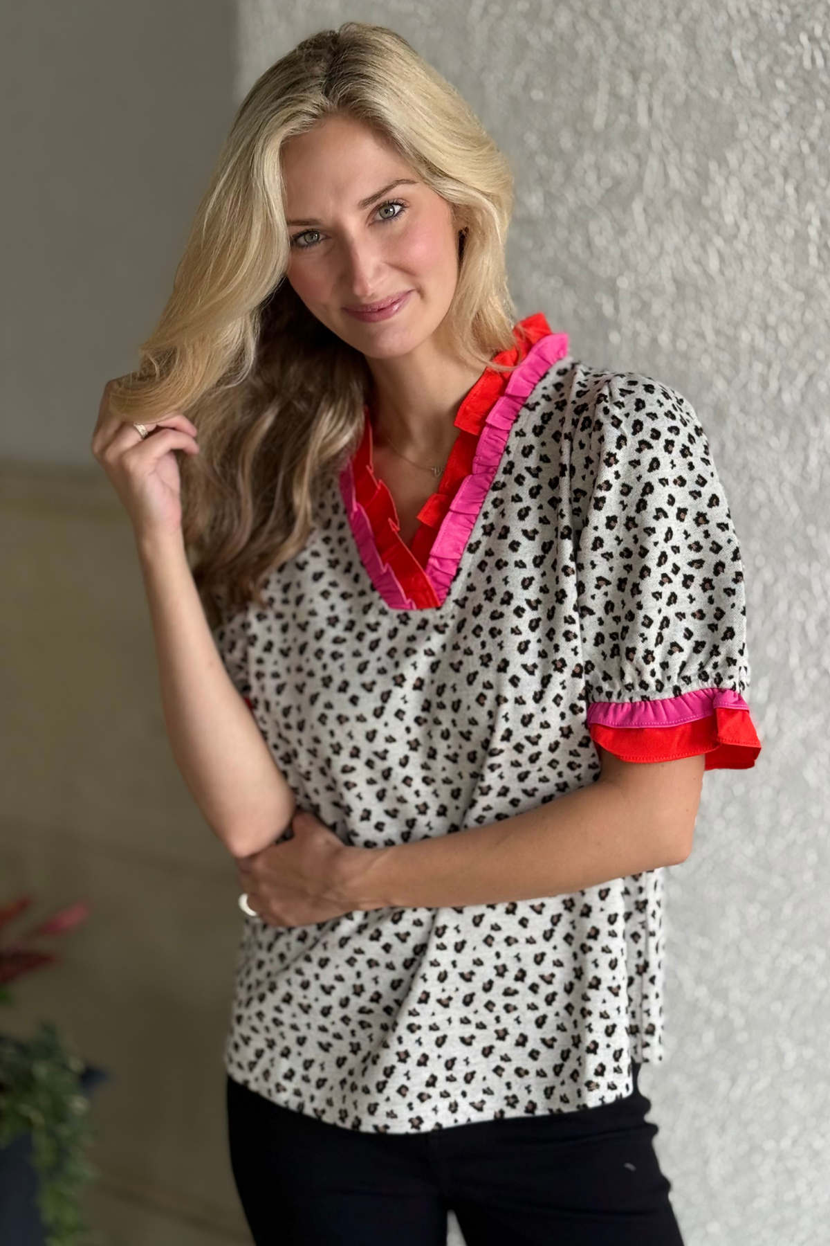Bold & Bright Ruffle Trim Top in black and white leopard print with pink and red accents