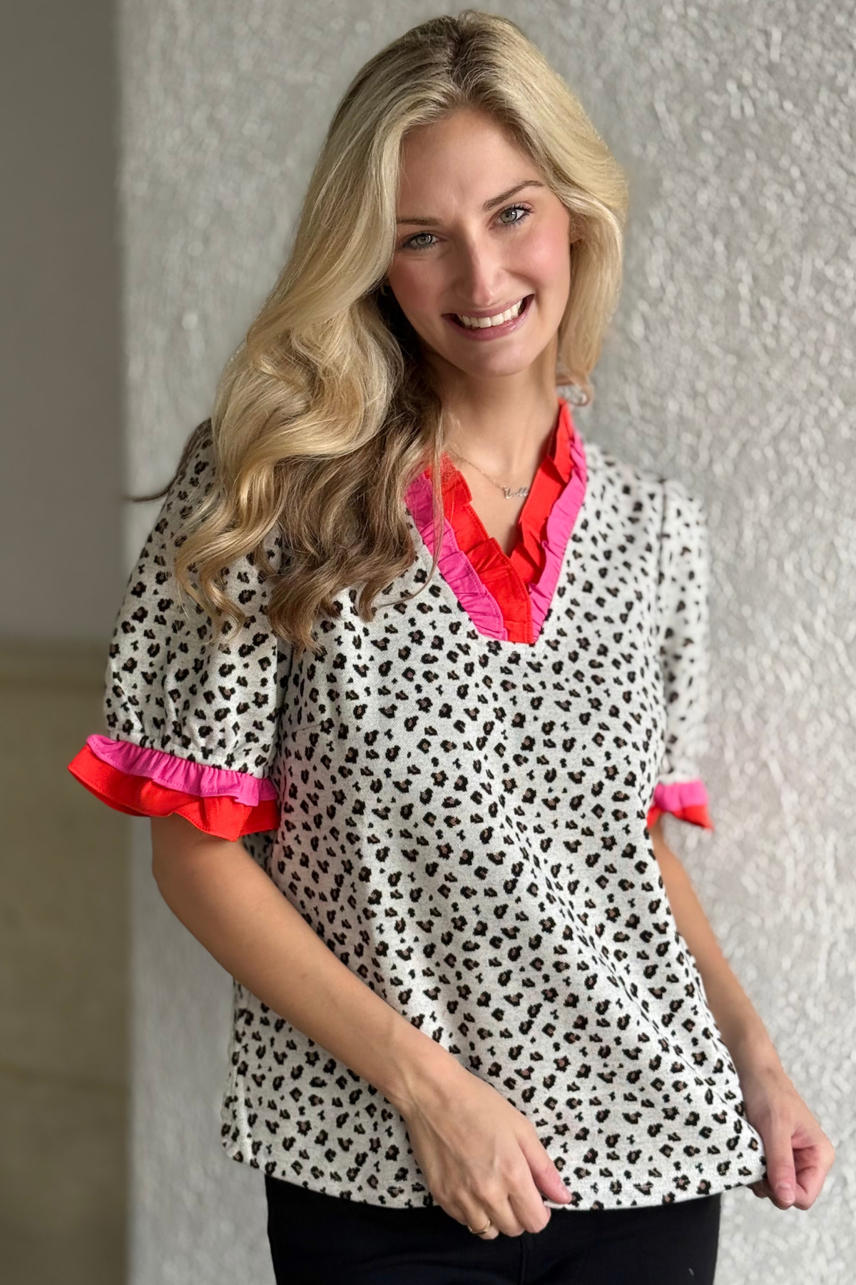 Close-up of colorful ruffle trim on Bold & Bright Leopard Print Top