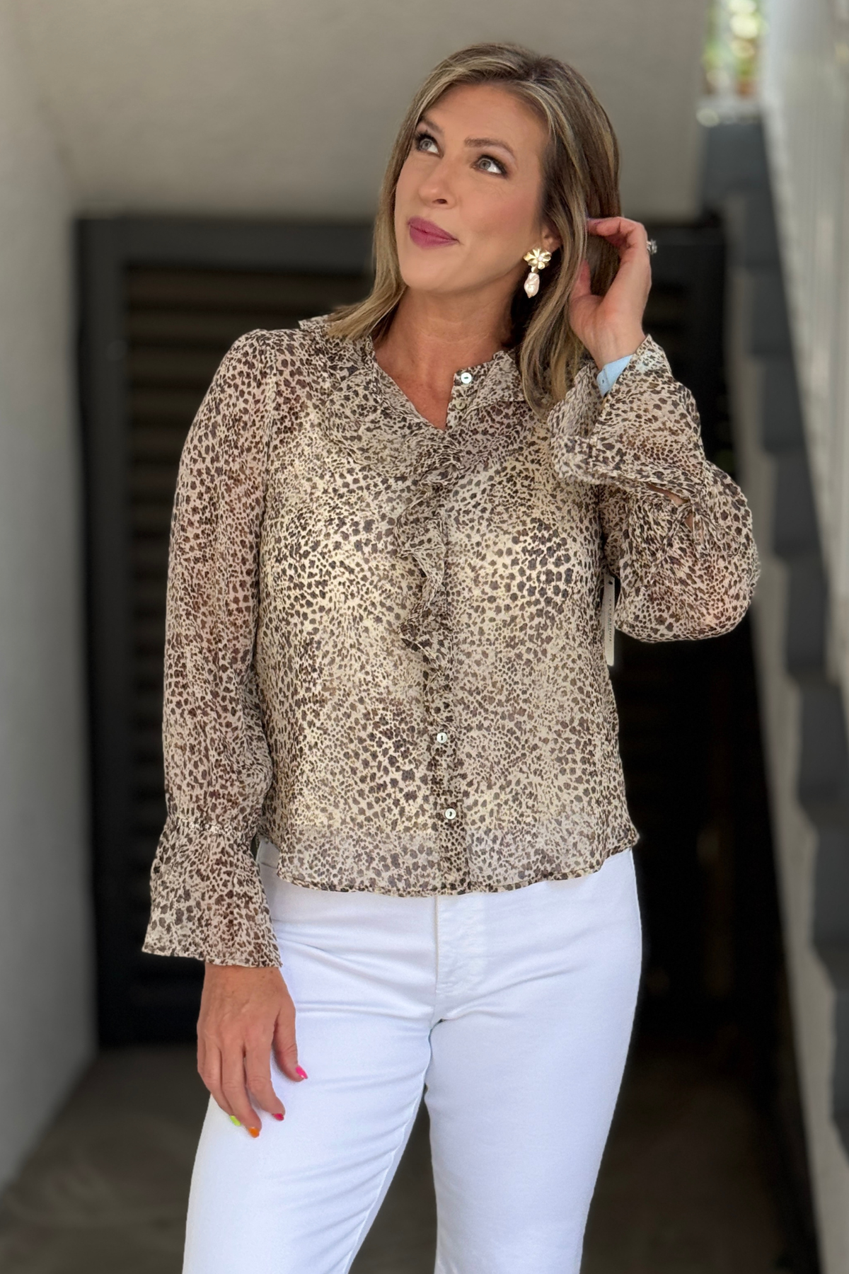 Women's animal print blouse with ruffle neckline