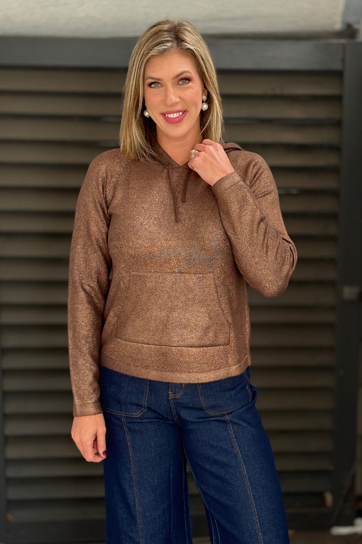Women’s metallic copper knit sweater with drawstring hood
