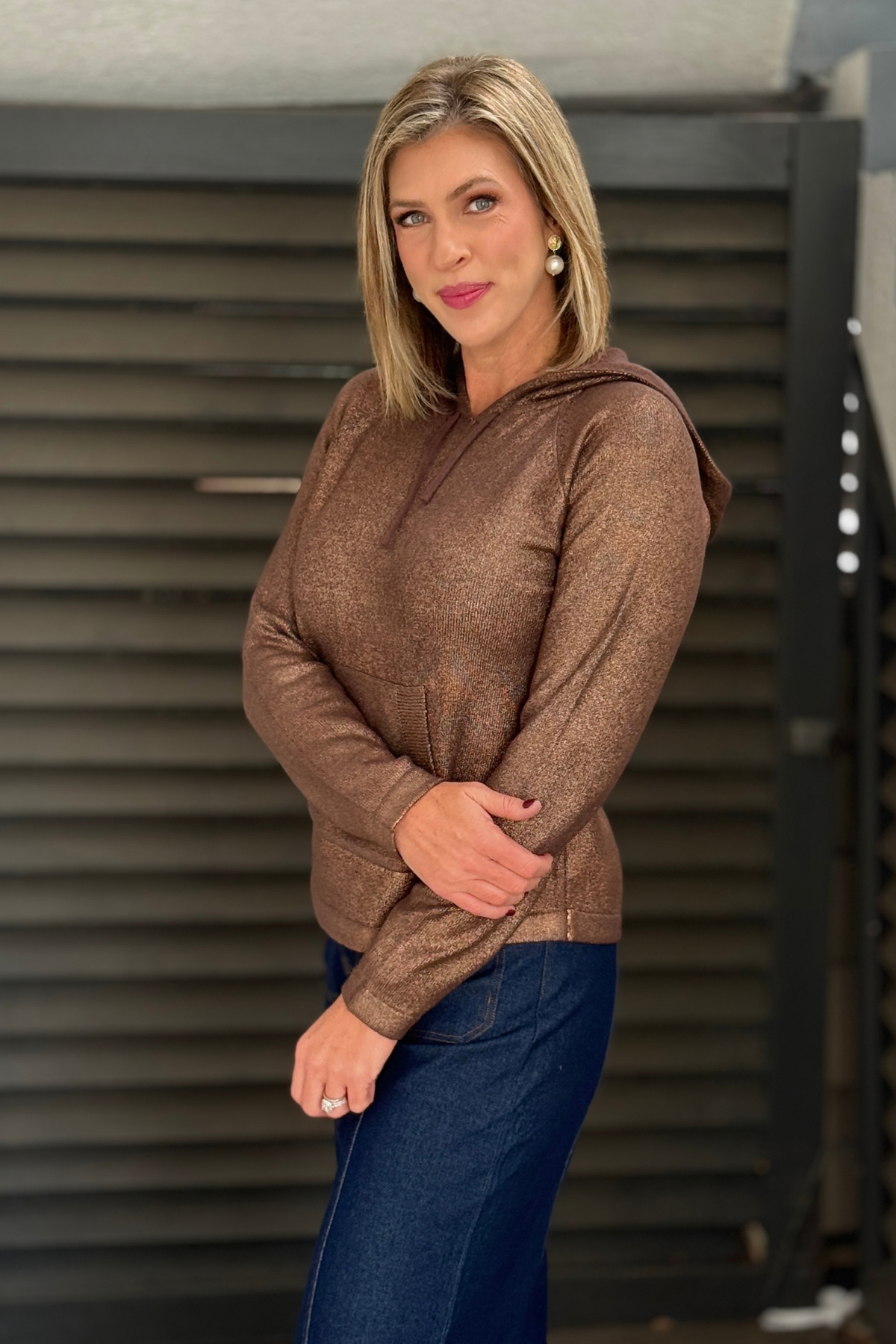 Lightweight copper hoodie sweater styled with denim