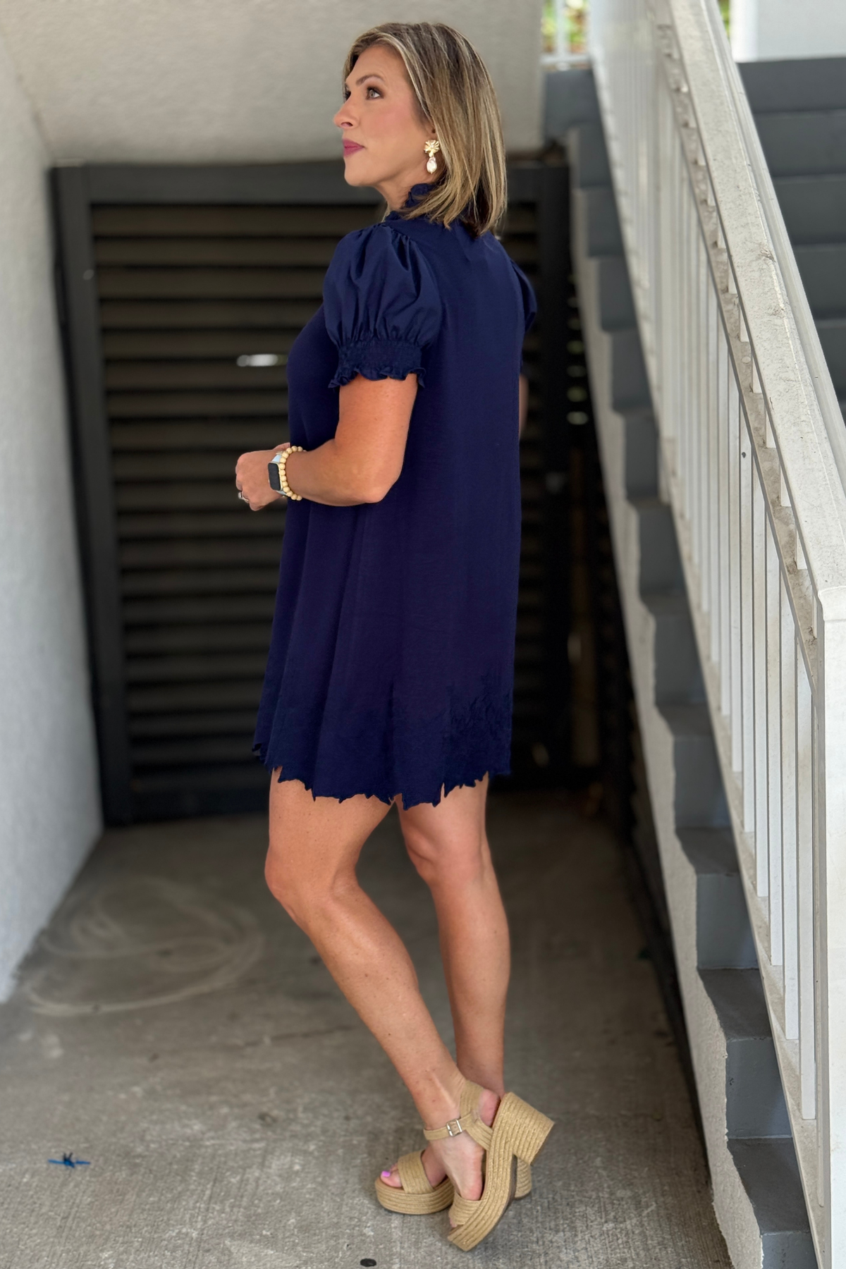 Navy embroidered dress with feminine details