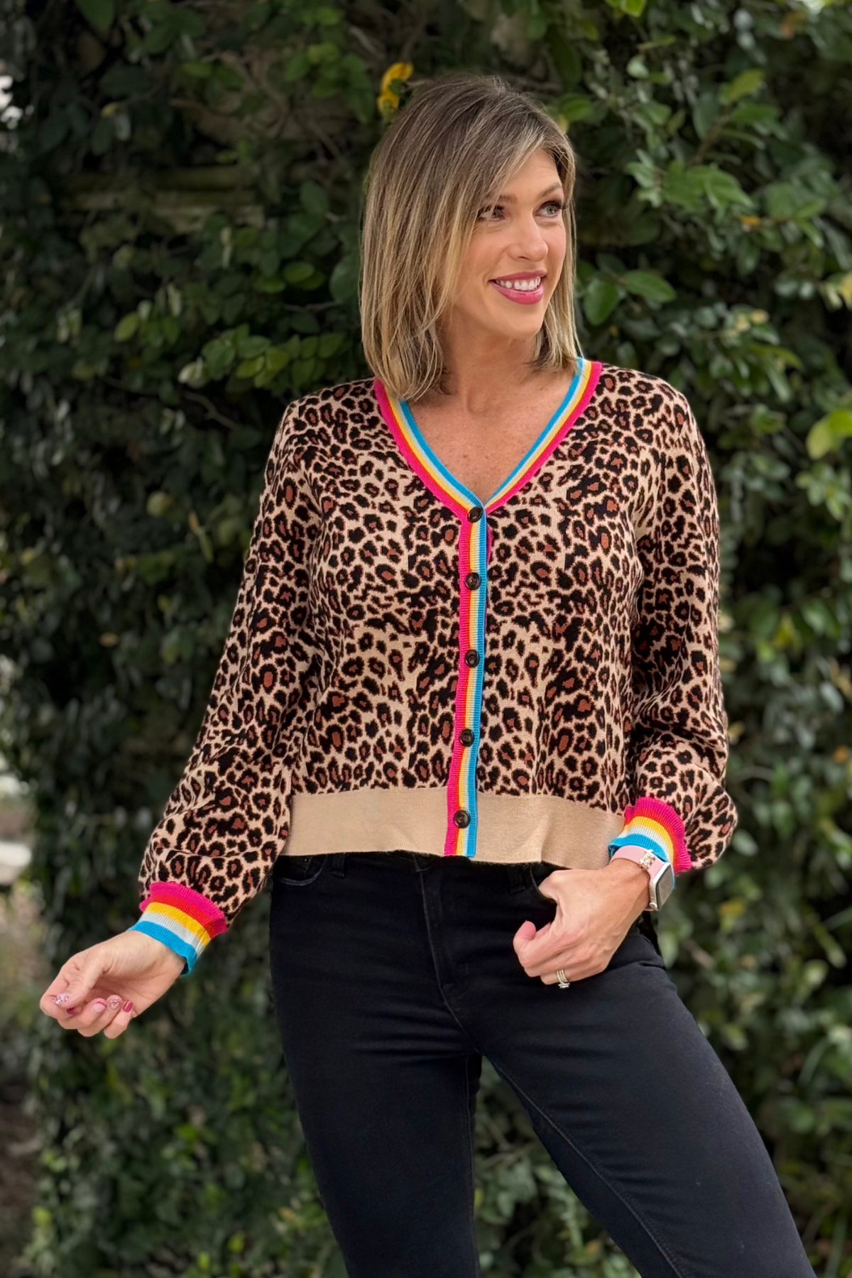 Woman wearing Wild Pop Leopard Cardigan with colorful trim