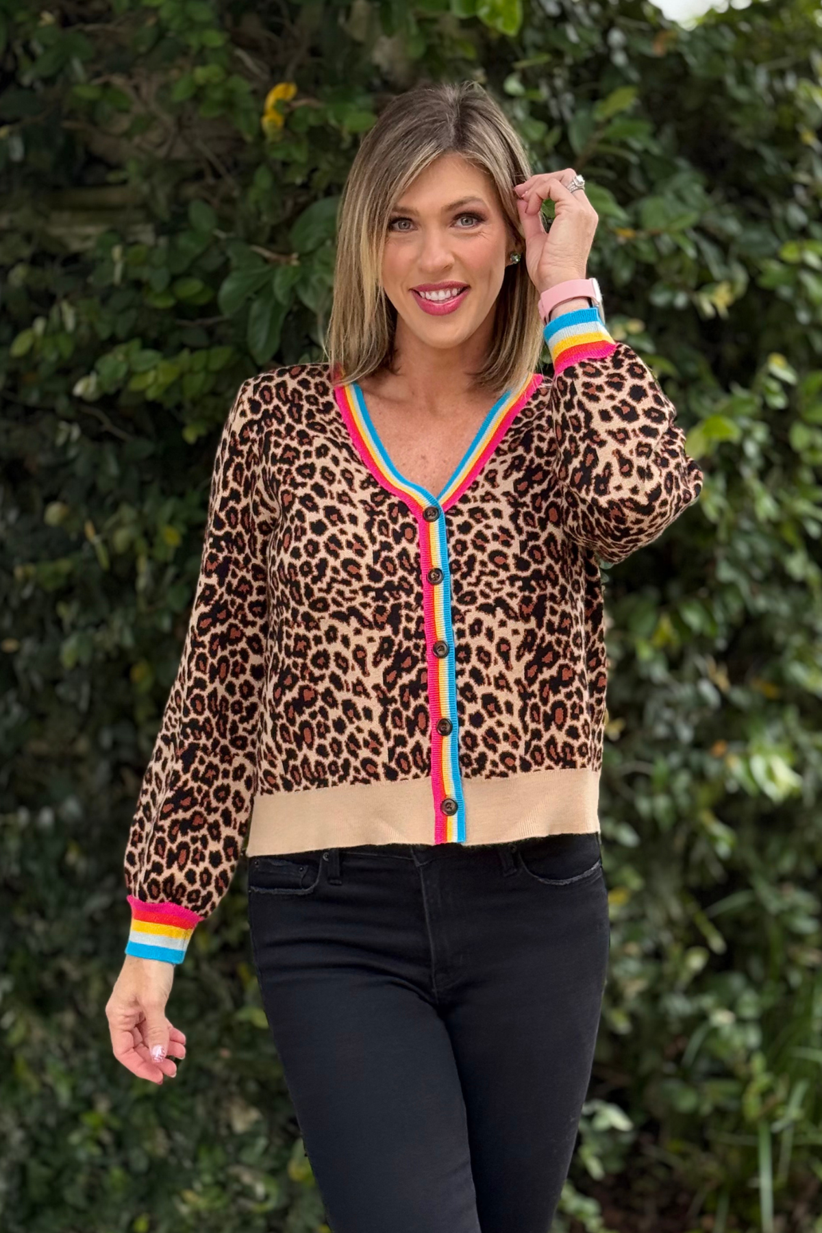 Close-up of leopard knit cardigan with rainbow detail