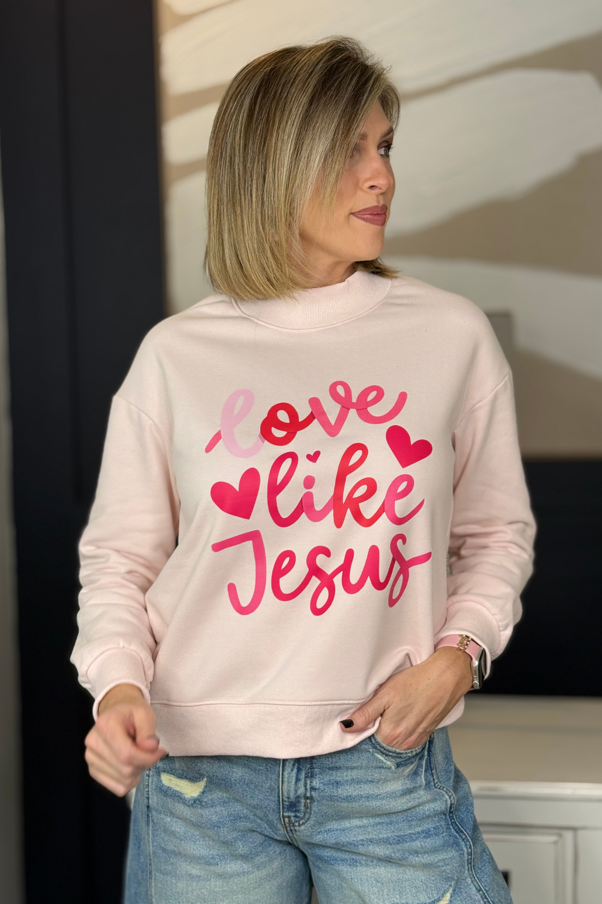 Faith based graphic sweatshirt with hearts and soft pink lettering