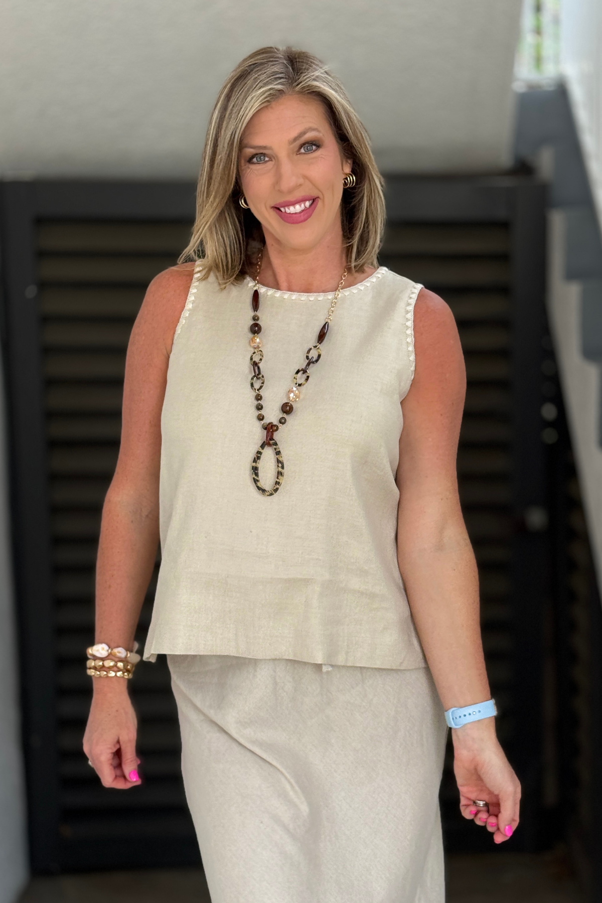 neutral flax linen sleeveless top with embroidered trim