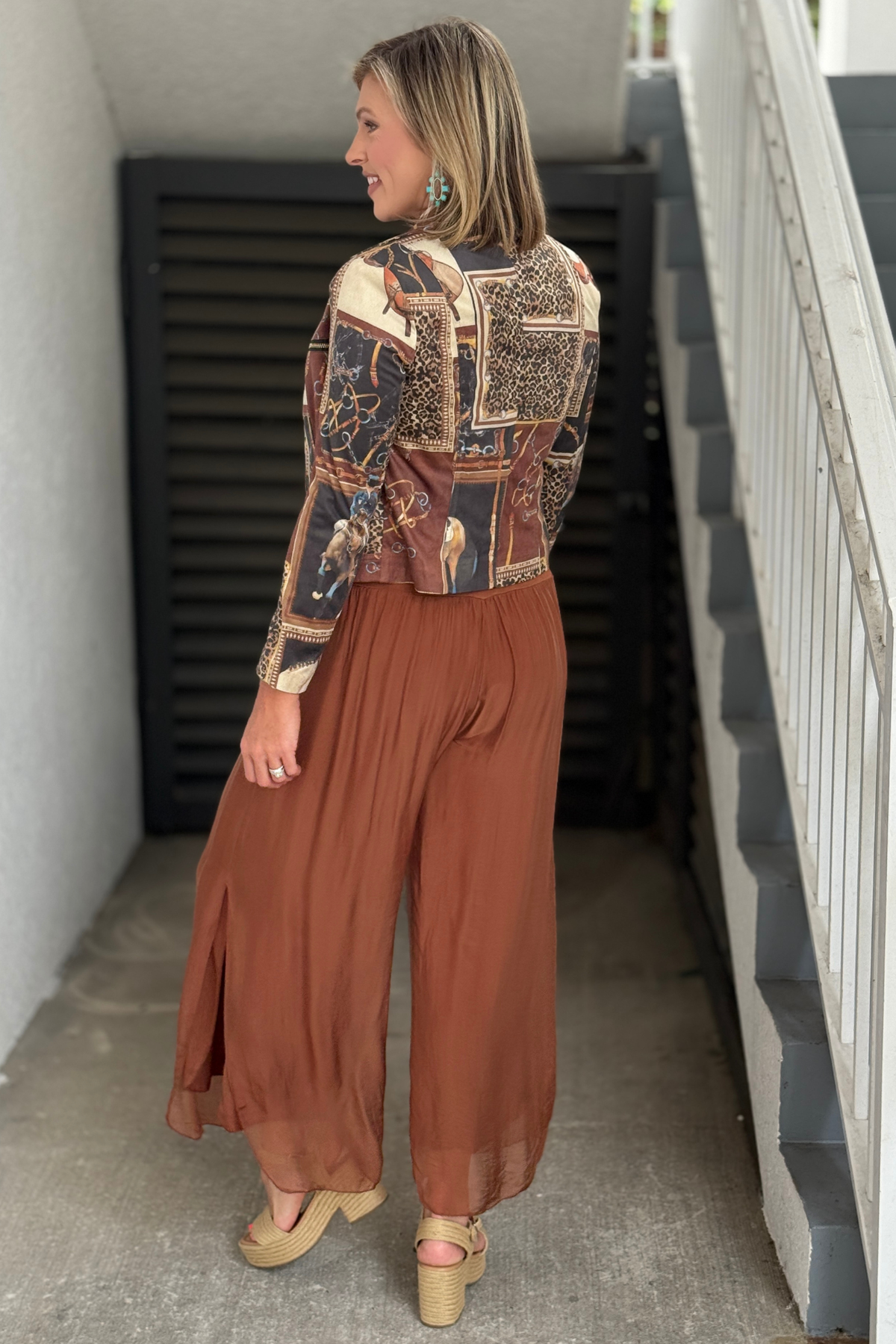 Women's flowing rust wide-leg pants.