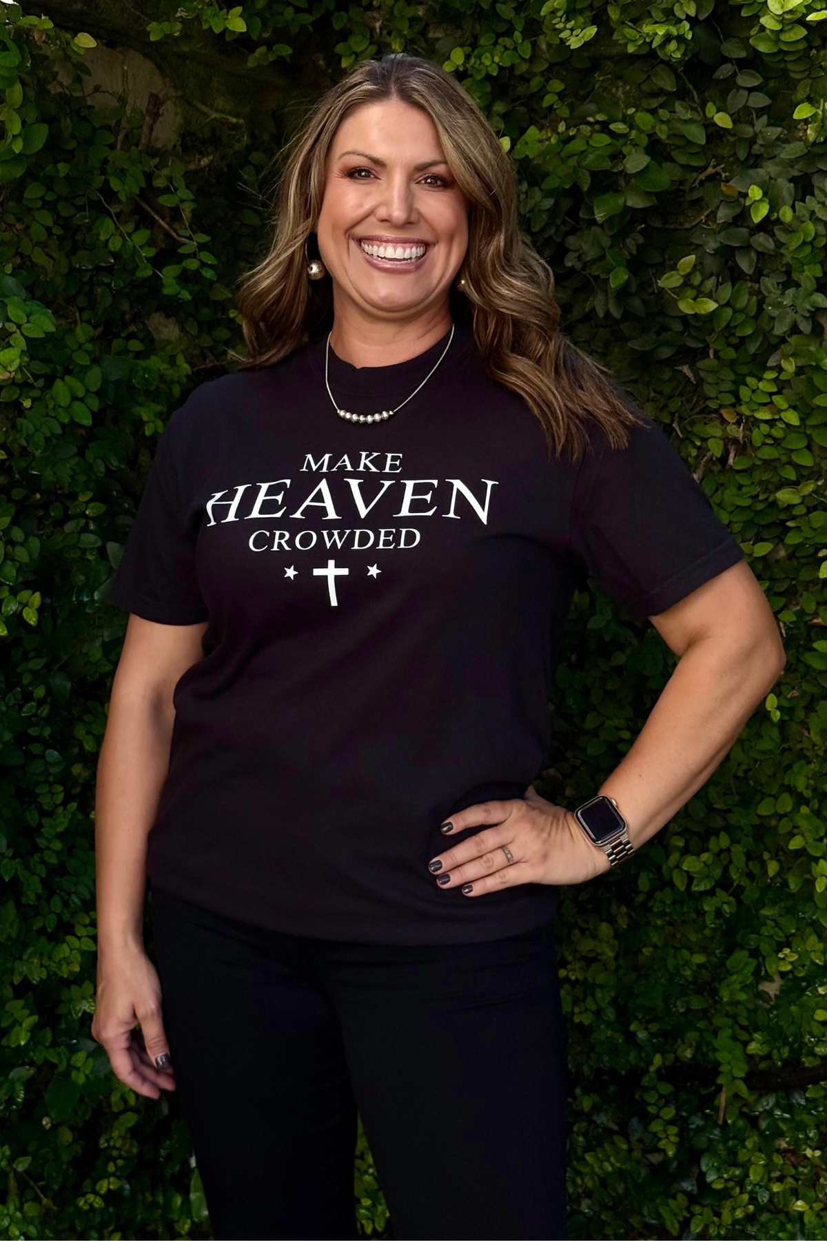 Women’s Christian graphic t-shirt with white lettering and cross design
