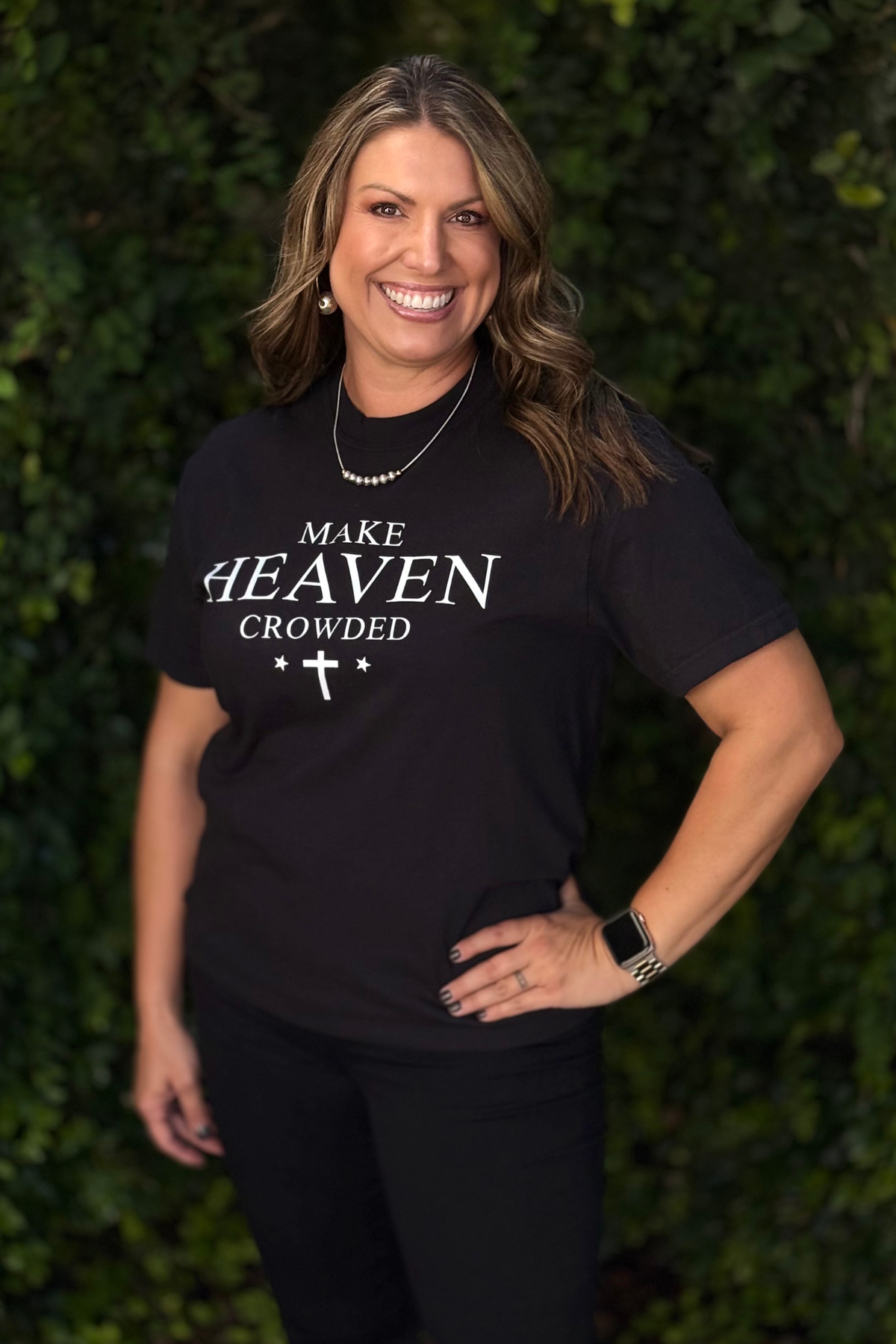 Faith-inspired black tee with “Make Heaven Crowded” text