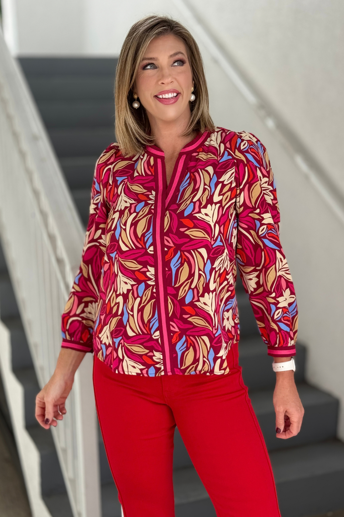 Mary Square Wind Rush Multi long sleeve blouse styled with red pants