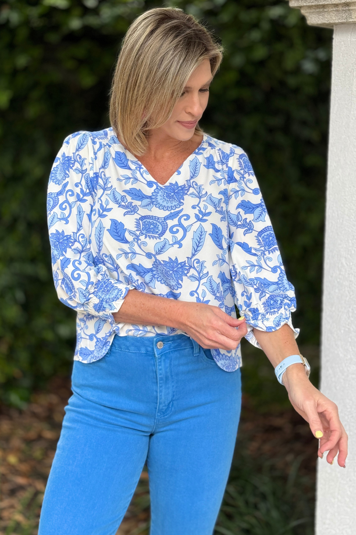 lightweight blue vine print top styled with white shorts