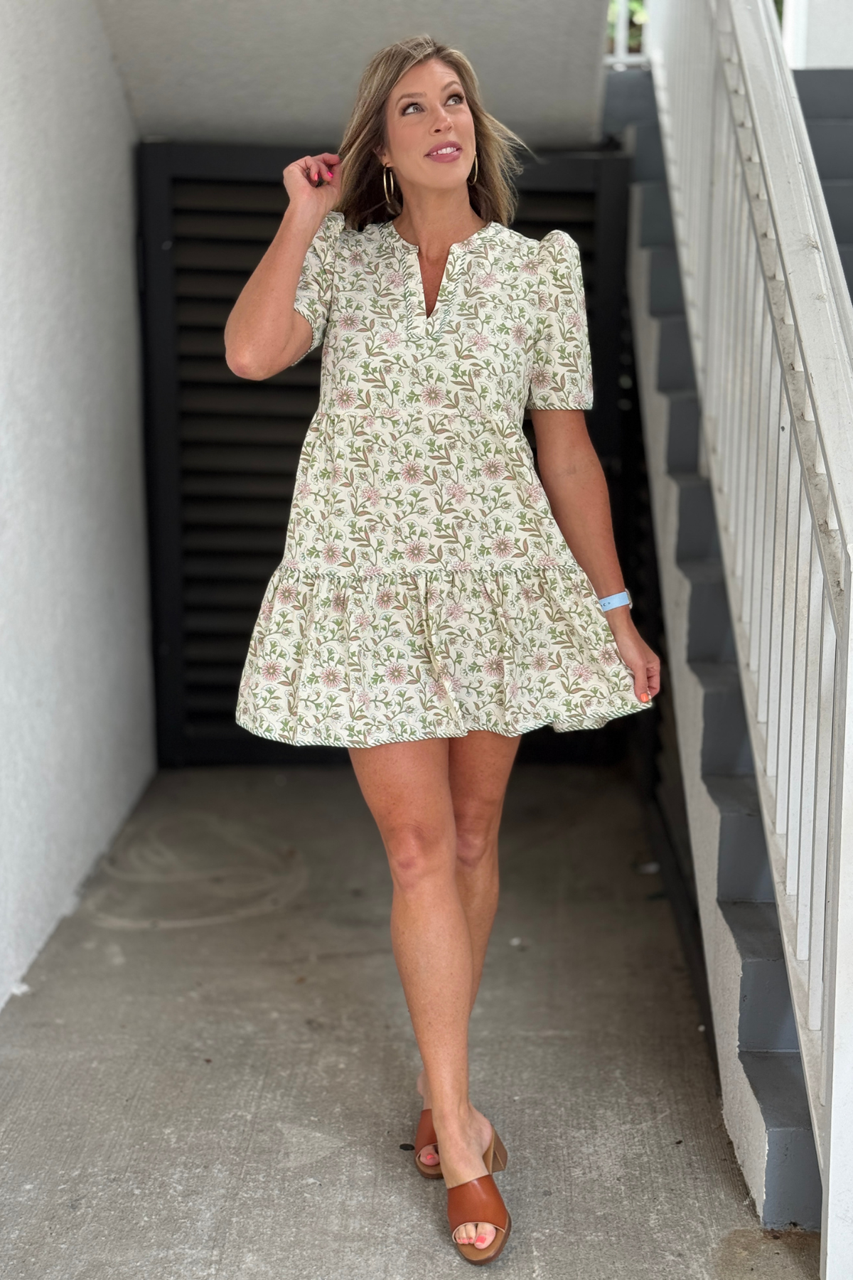 Women's floral tiered dress with puff sleeves and pockets