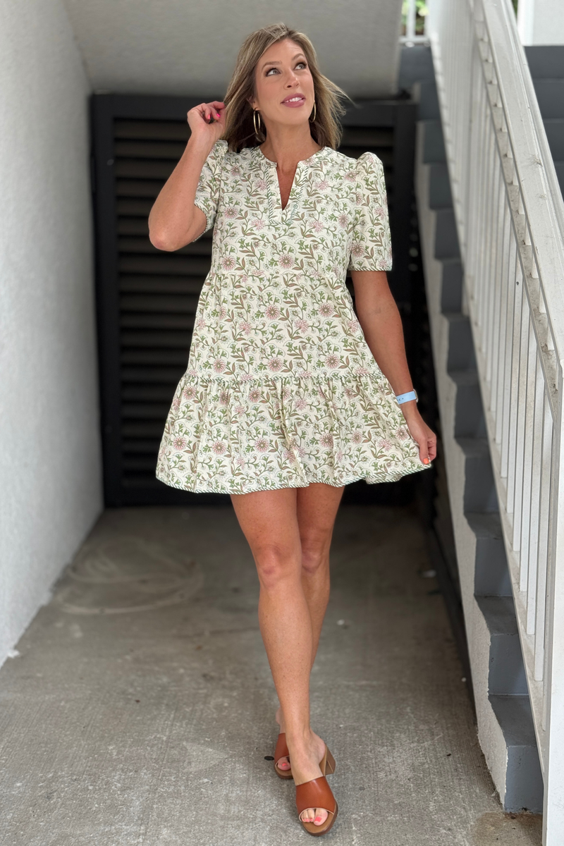 Women's floral tiered dress with puff sleeves and pockets
