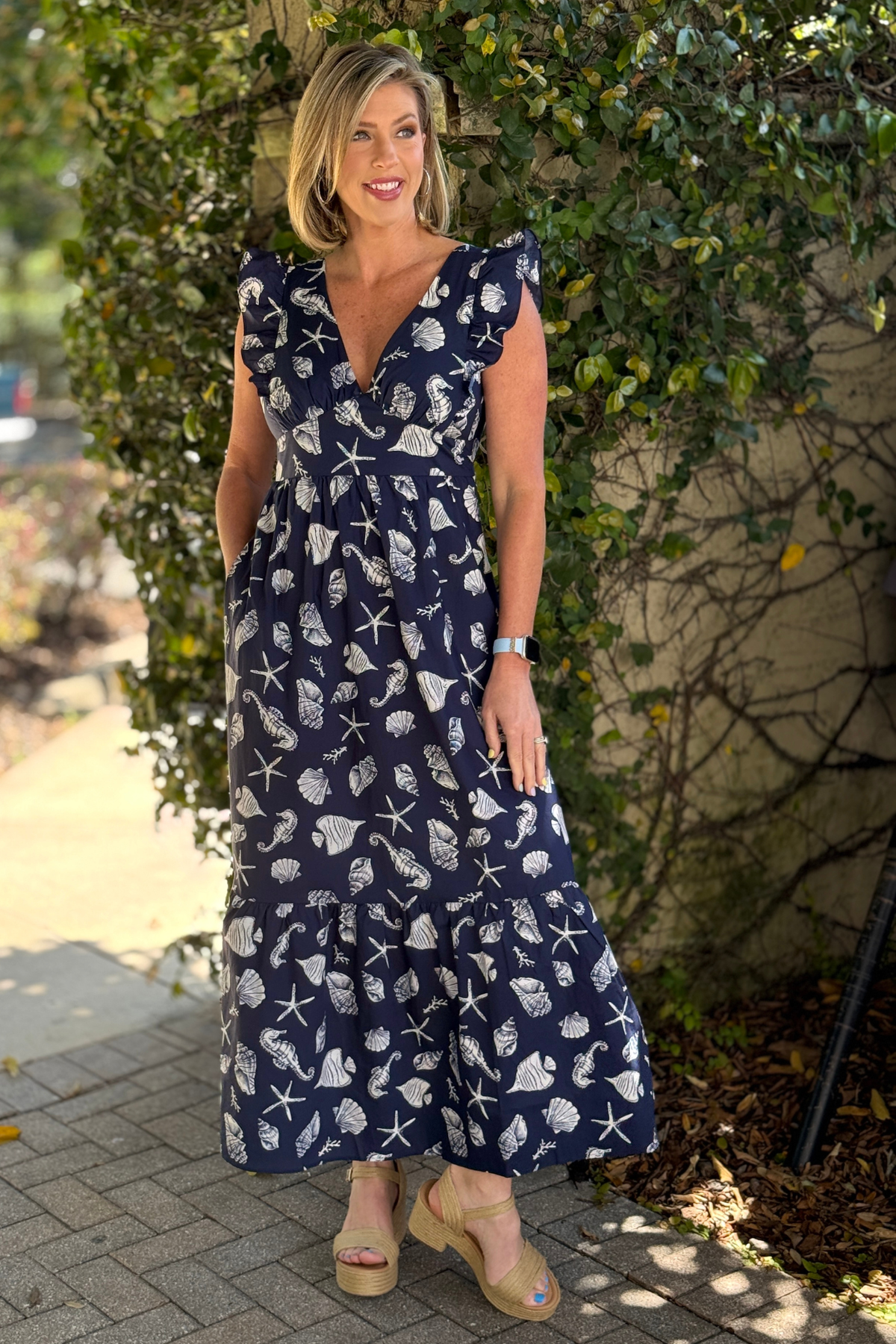 Coastal navy maxi dress with seashell pattern and flowy skirt