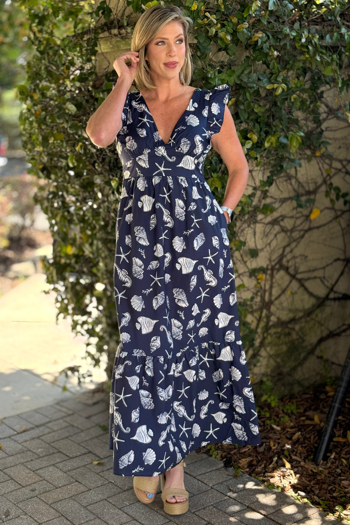Navy seashell print maxi dress front view with ruffle sleeves