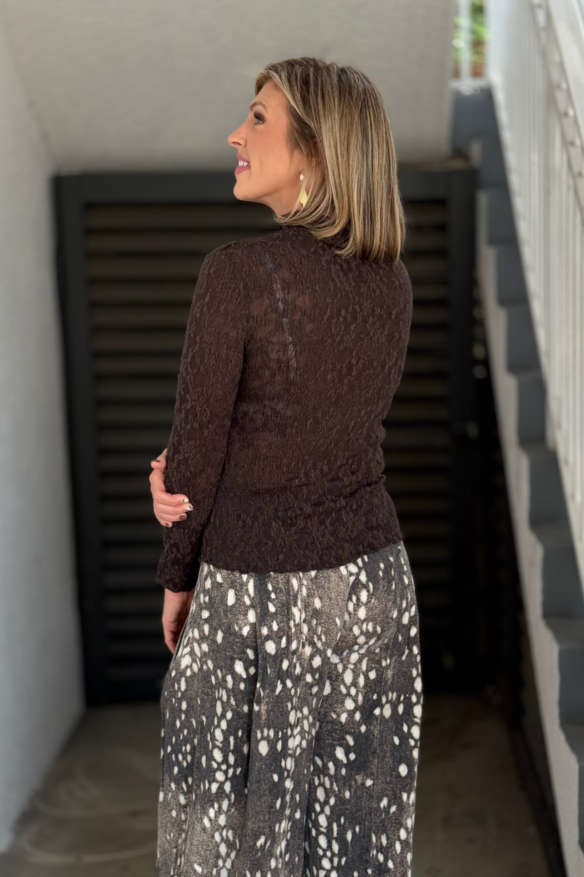Chocolate brown mock neck top with lettuce-edge trim