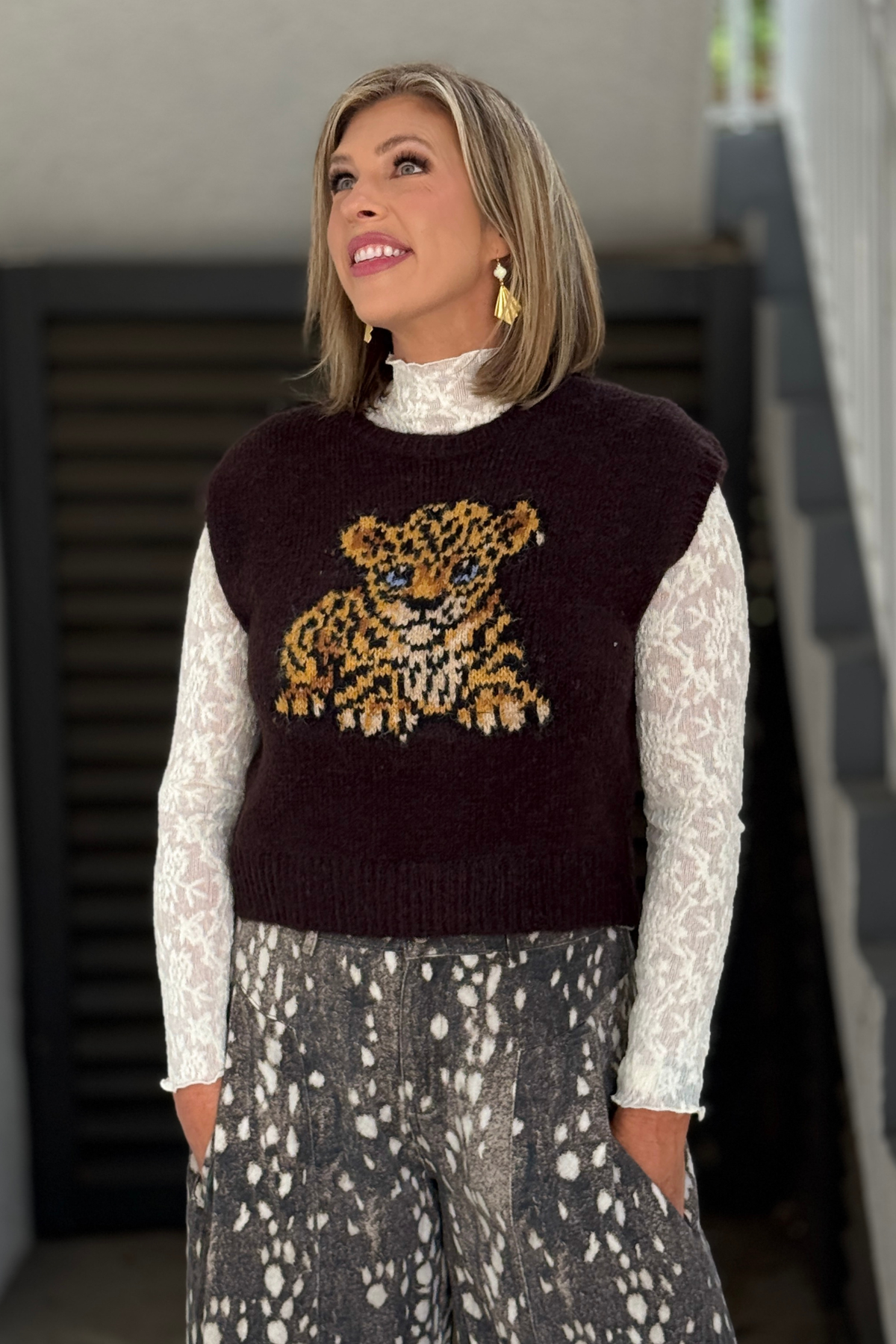 Baby Leopard Sweater Vest layered over white blouse