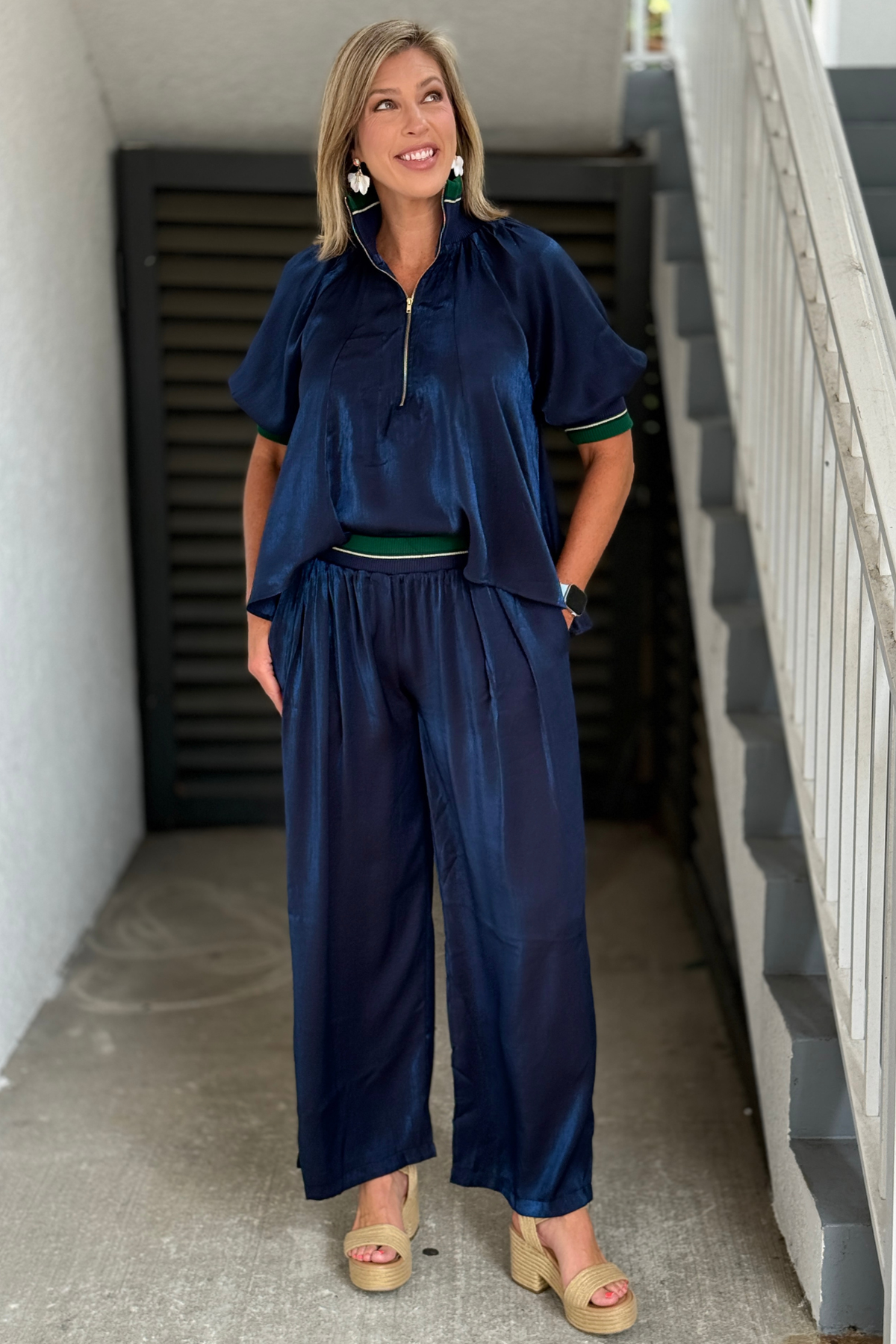 Woman wearing Monaco Midnight Satin Wide Leg Pants in navy