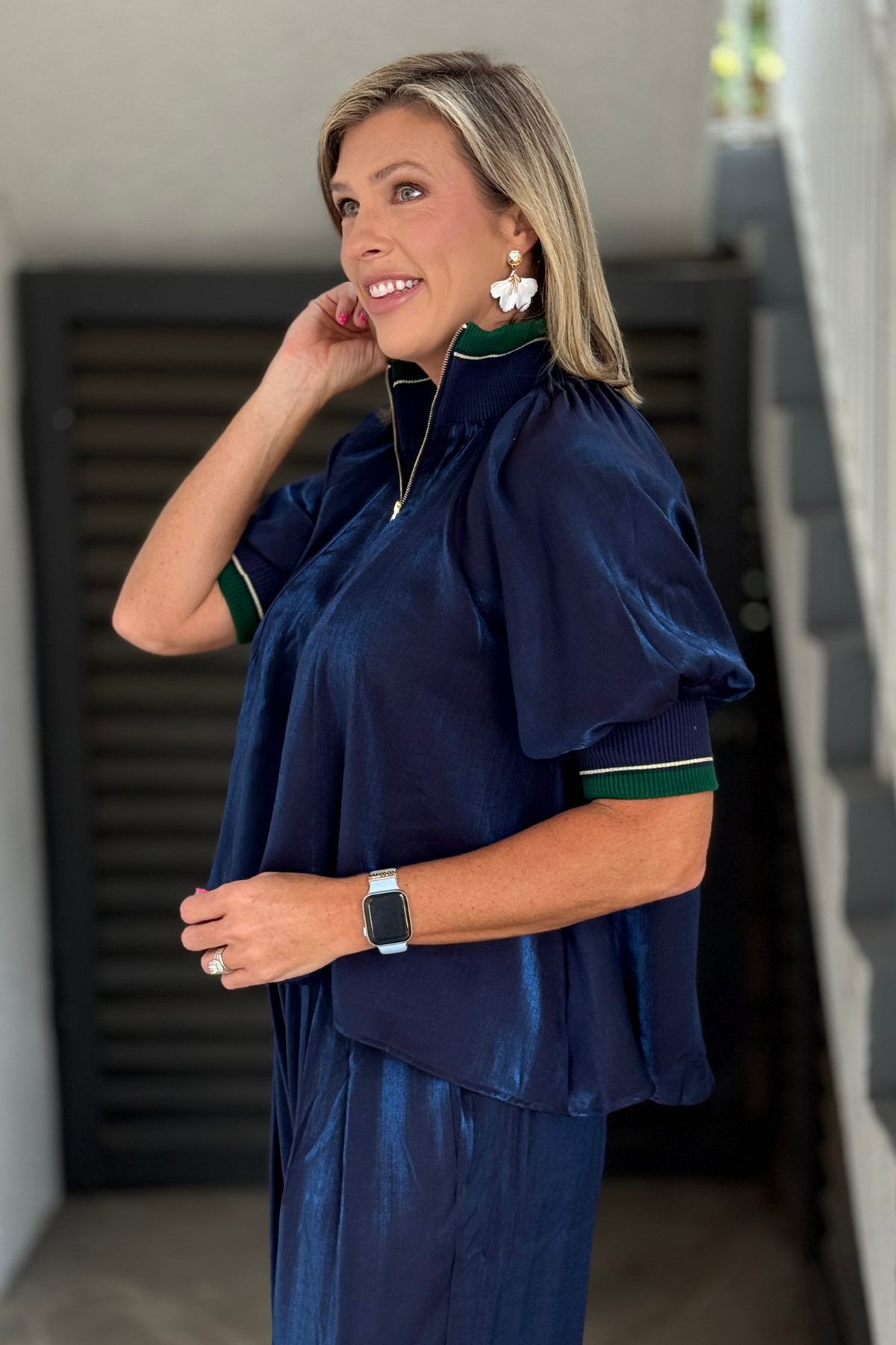 Front view of navy zip neckline blouse