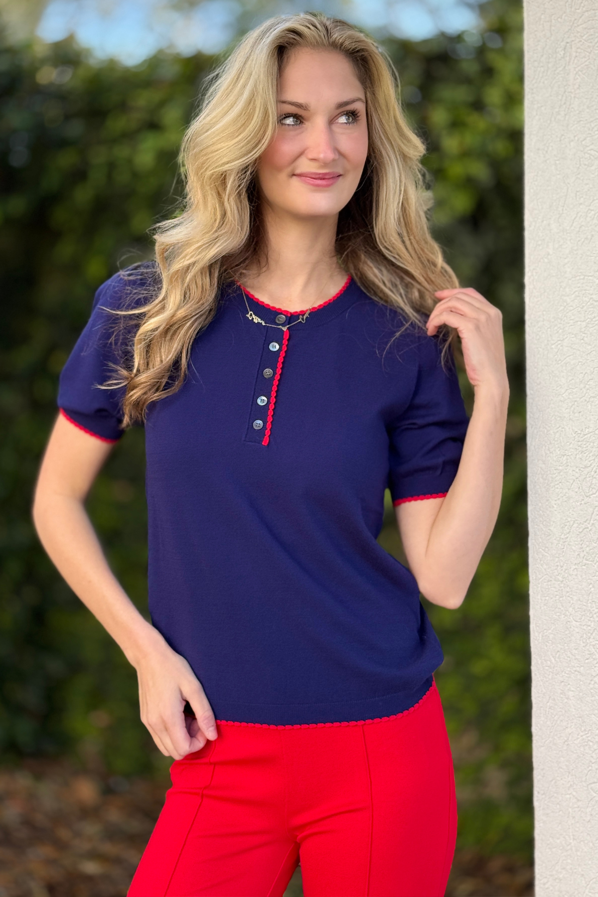 Darling Detail Contrast Sweater in Navy front view with scalloped red trim