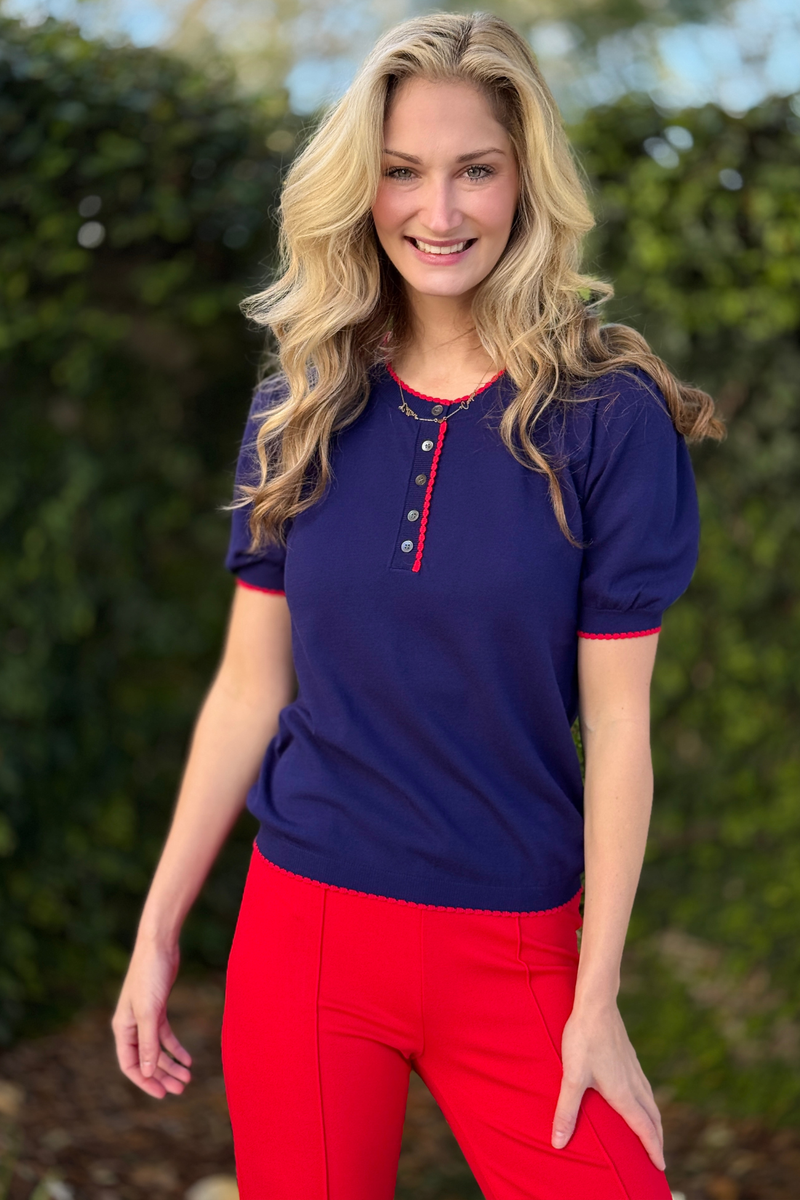 Back view of navy contrast sweater with heart motif detail