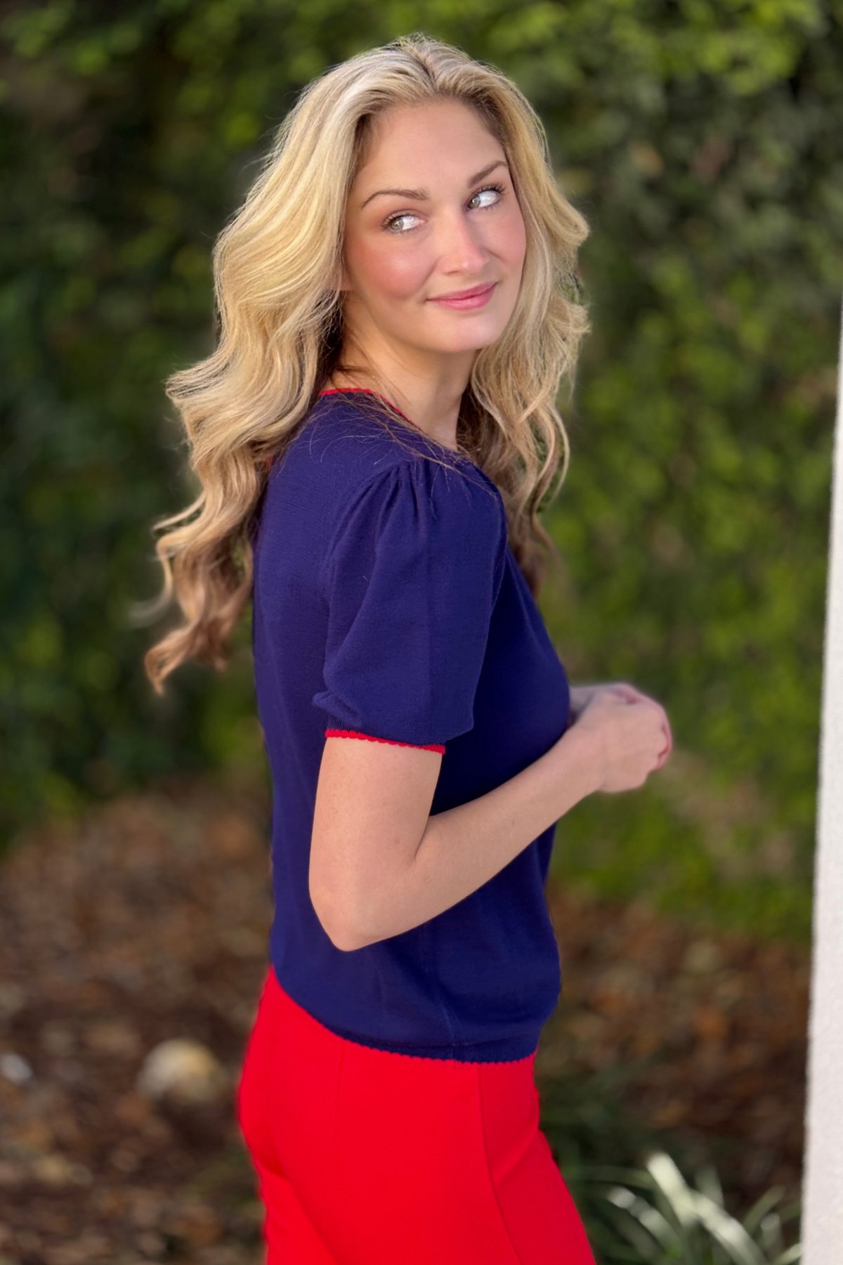 Close up of scalloped trim neckline and half button placket