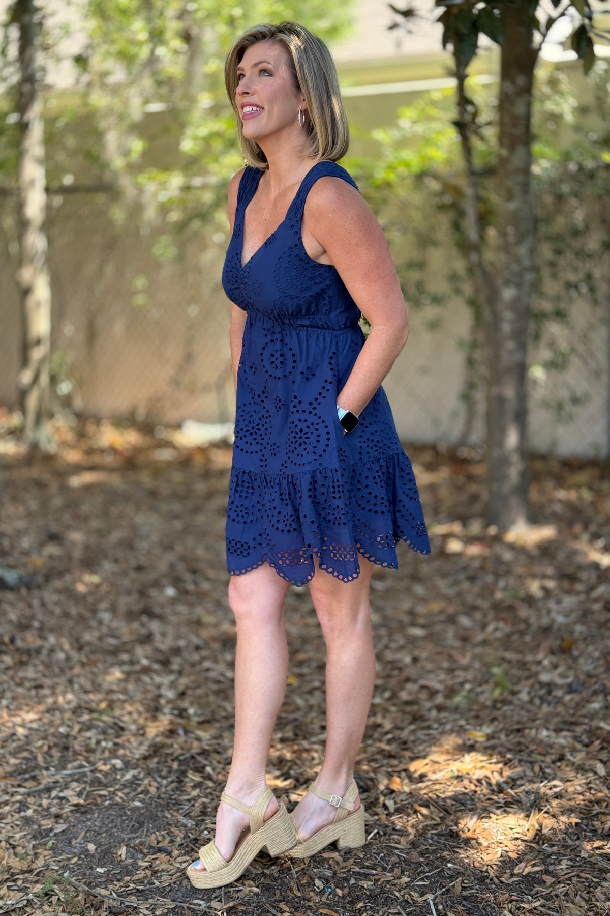 Lightweight navy boutique dress with scalloped hem and flowy skirt