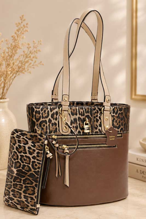 Millie genuine leather leopard print tote bag in brown, Brown genuine leather tote handbag with leopard print upper panel, Women’s brown and leopard print leather tote with gold hardware, Structured genuine leather leopard handbag with shoulder straps, Brown leather tote bag with front zipper pockets and leopard print, Millie leopard print genuine leather everyday handbag