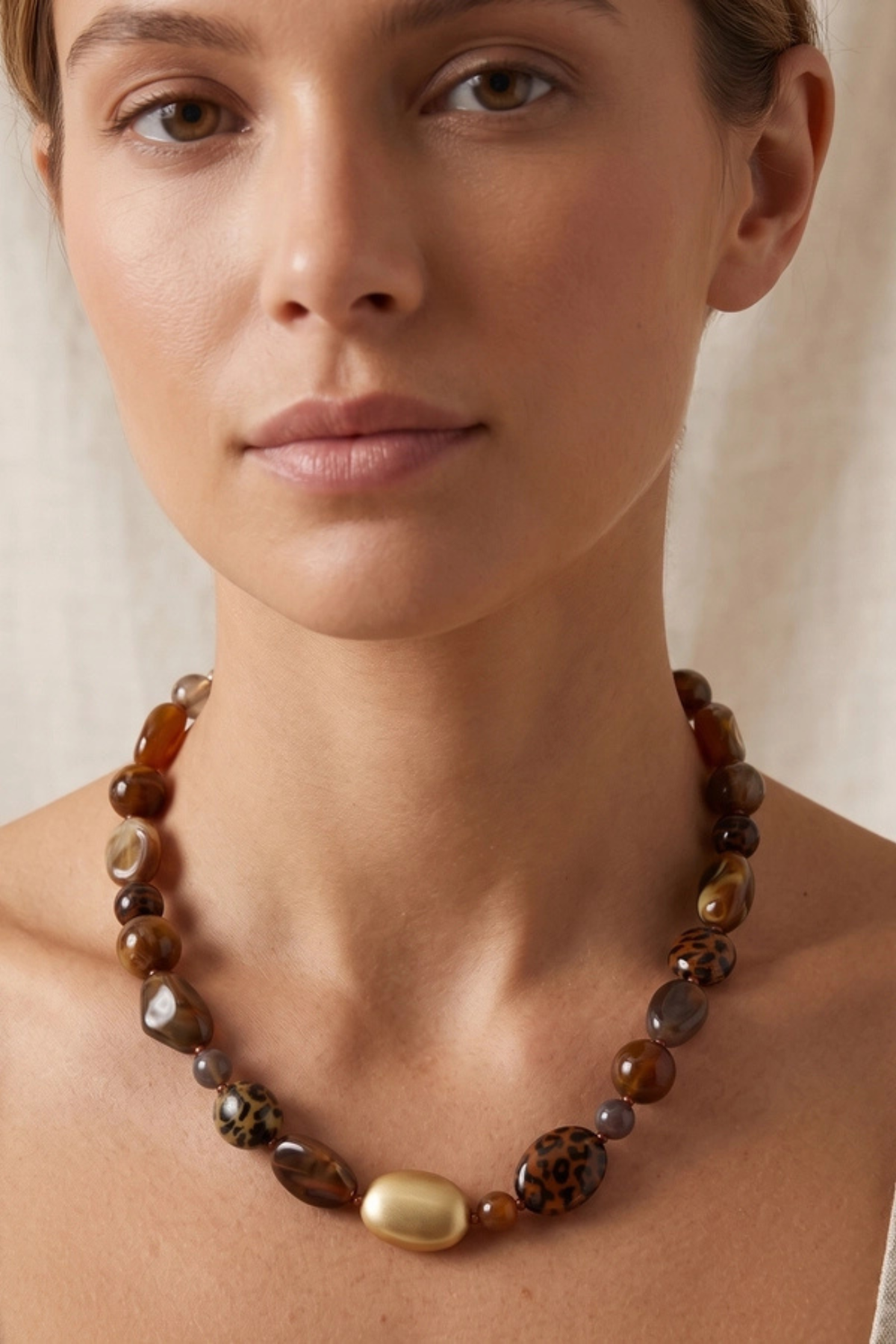 Leopard and marble resin pebble necklace
Matte gold and resin statement necklace