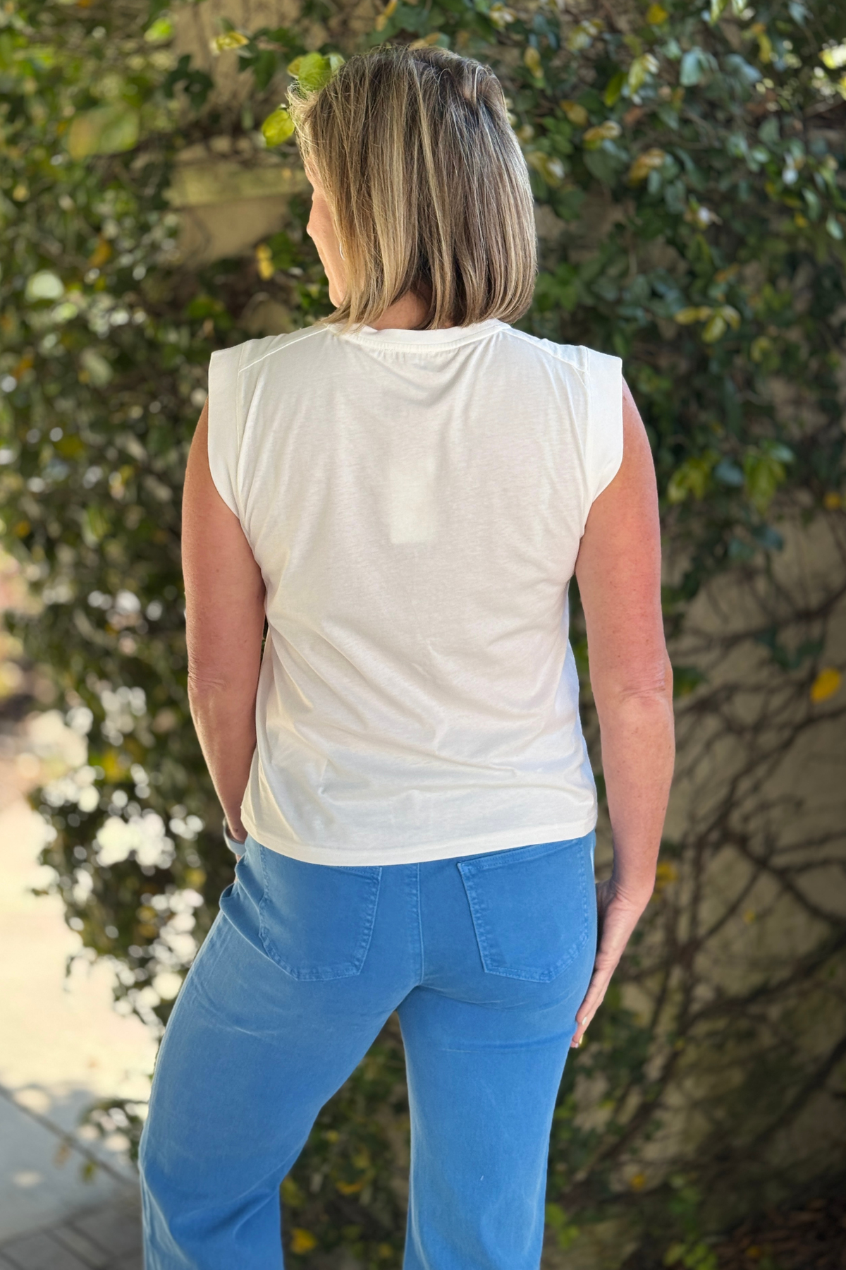 Casual summer outfit with graphic tee and wide leg jeans