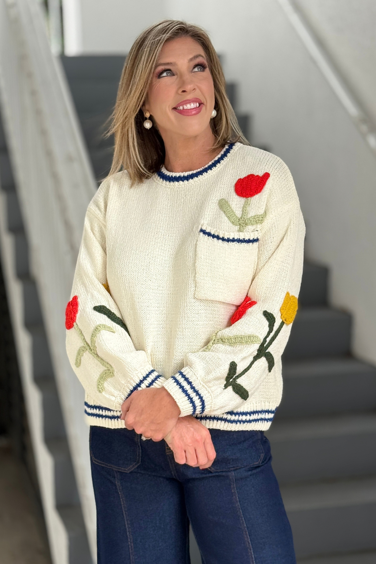 Cream chenille sweater with colorful floral embroidery